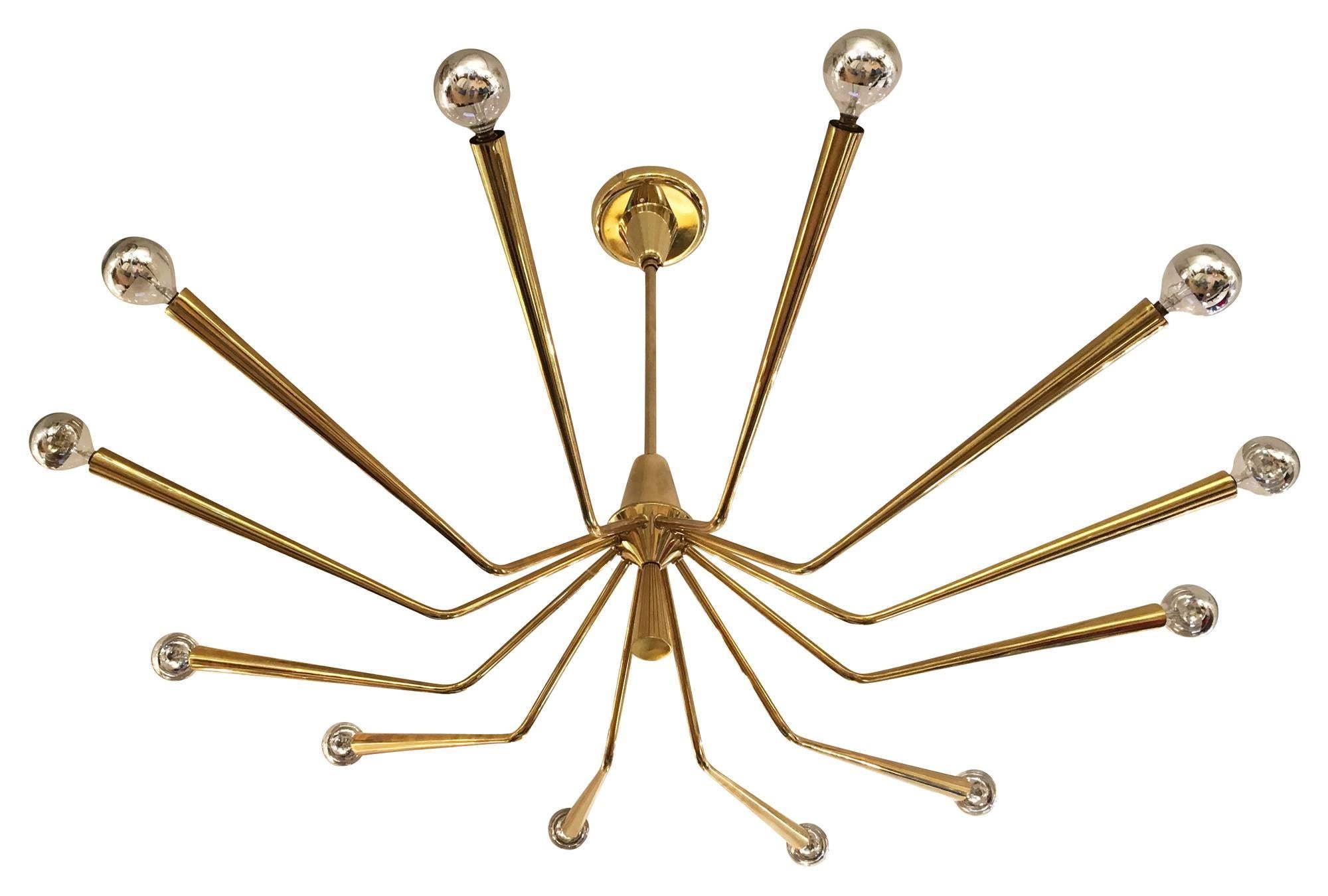 Large brass chandelier designed by Oscar Torlasco for Lumi in the 1960s. Holds 12 candelabra sockets.