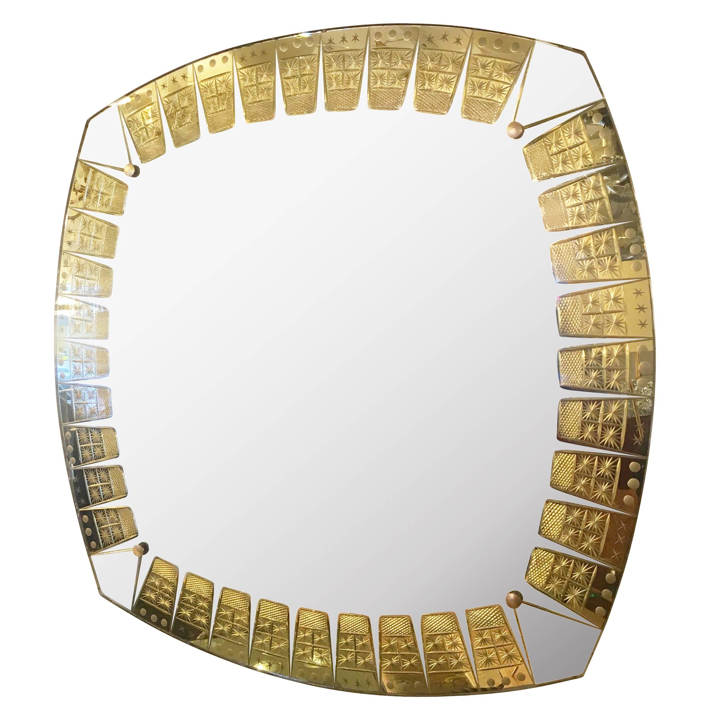 Beautiful Mid-Century mirror manufactured by crystal Art. The edges are skill fully decorated with a gold etching.
