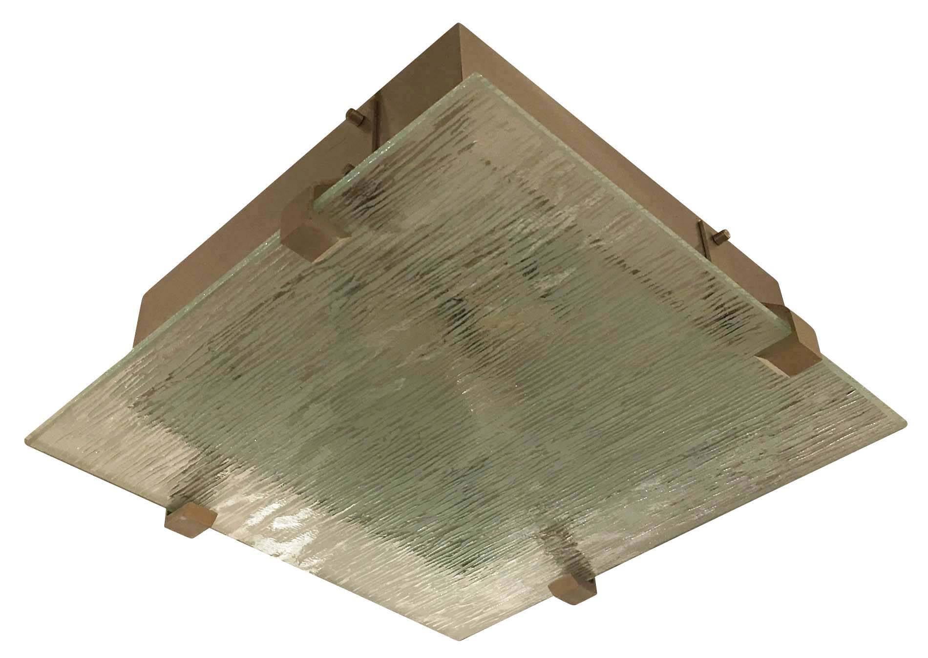 Pair of 1960s Italian flush mounts each featuring a beautifully crafted etched square glass. The glass has a slight aqua tint as typically seen in Mid-Century glass. The hardware is brushed nickel and each holds three sockets. Price per item.
