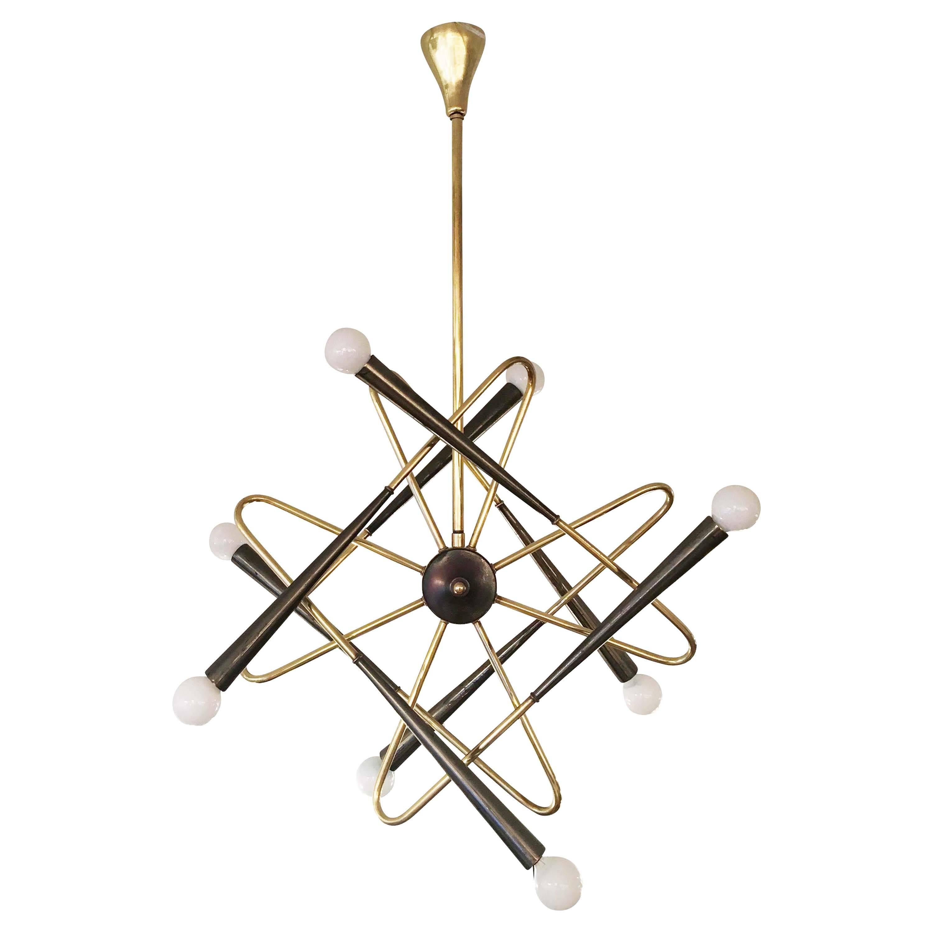 Rare Stilnovo attributed brass chandelier featuring eight bent arms terminating in gray conical shades. The arms create a beautiful illusion of movement.
 