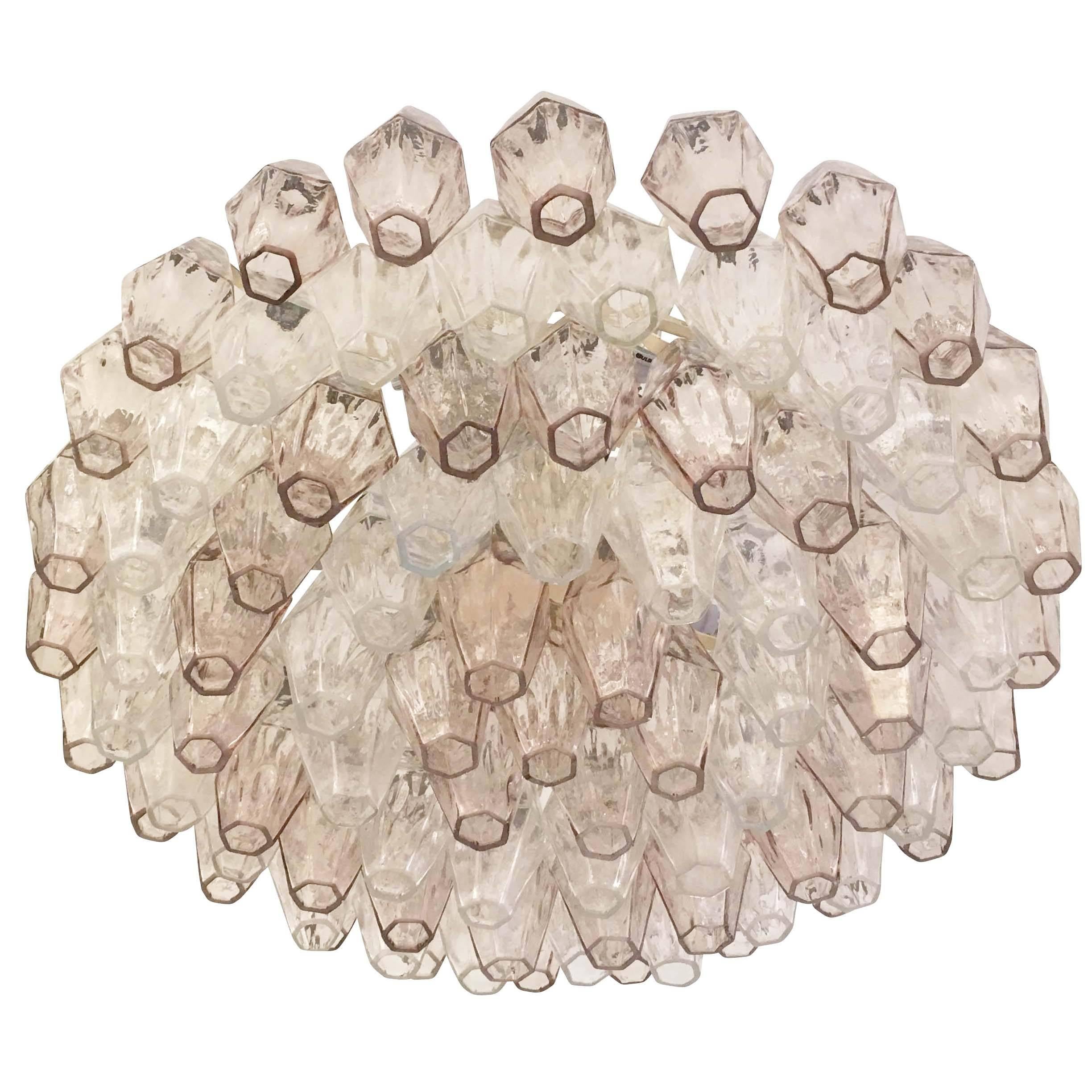 Original polyhedral chandelier made by Venini in the 1960s. This timeless Murano fixture has alternating rows of clear and light pink glasses on an off-white frame. Additional clear poliedri are available if needed with all clear glasses. Can be