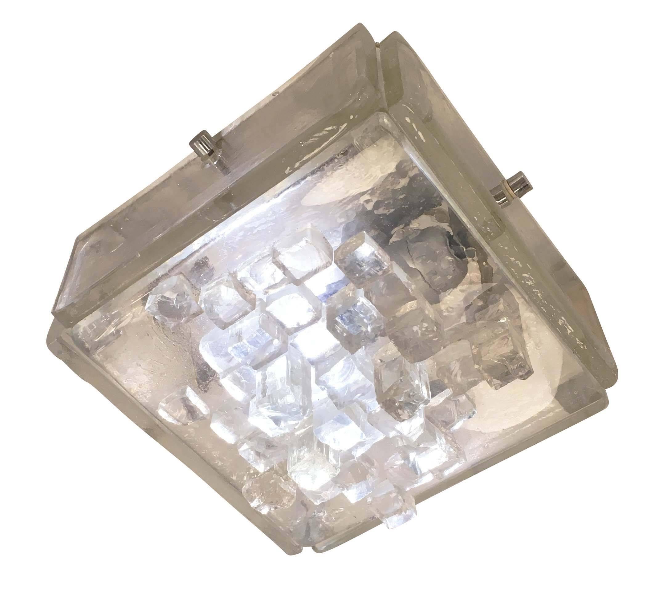 Square Murano glass fixture made by Poliarte in the 1960s that can be used as either wall light or ceiling flush mount. It's made of five thick glass slabs with the larger one being decorated with small glass cubes of different sizes. Holds one