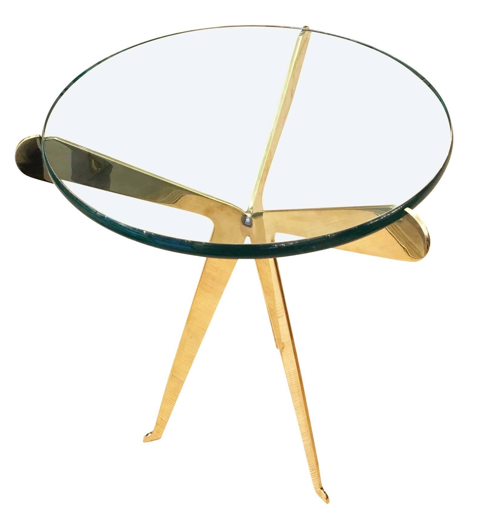 Large brass side table or gueridon with three legs and a thick glass top with rounded edges. Designed by Gaspare Asaro and manufactured in limited quantities. Also available nickel plated as well as in a smaller size.
