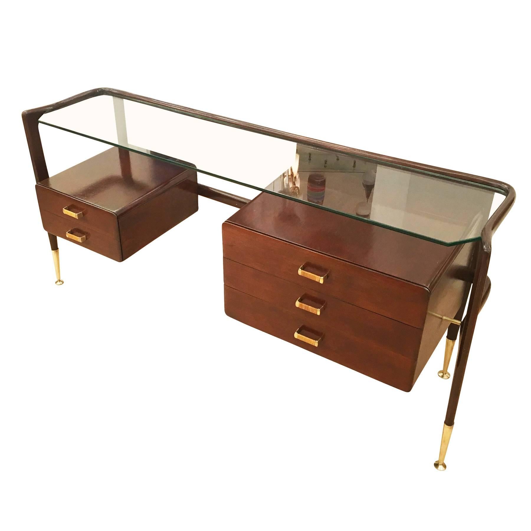 Elegant Italian Mid-Century piece that can be used as a console or a shallow desk. It is made in rosewood had has a glass top and brass fittings.