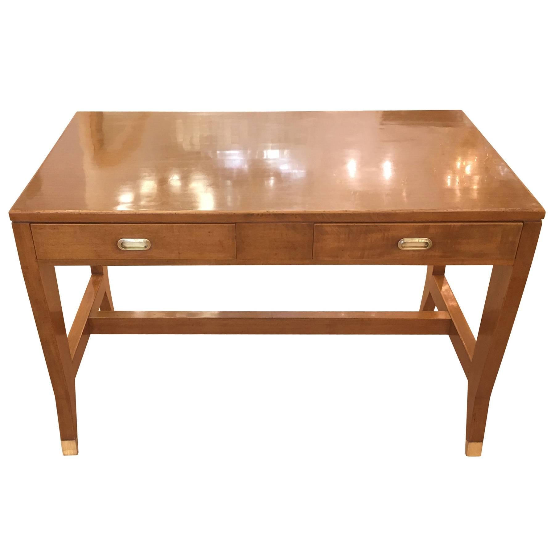 Beautiful walnut desk by Gio Ponti for the Banca Nazionale del Lavoro in Mantova. The handles and feet are brass. Has been left in its charming original conditions but can be re-finished in a different color for an additional cost.

