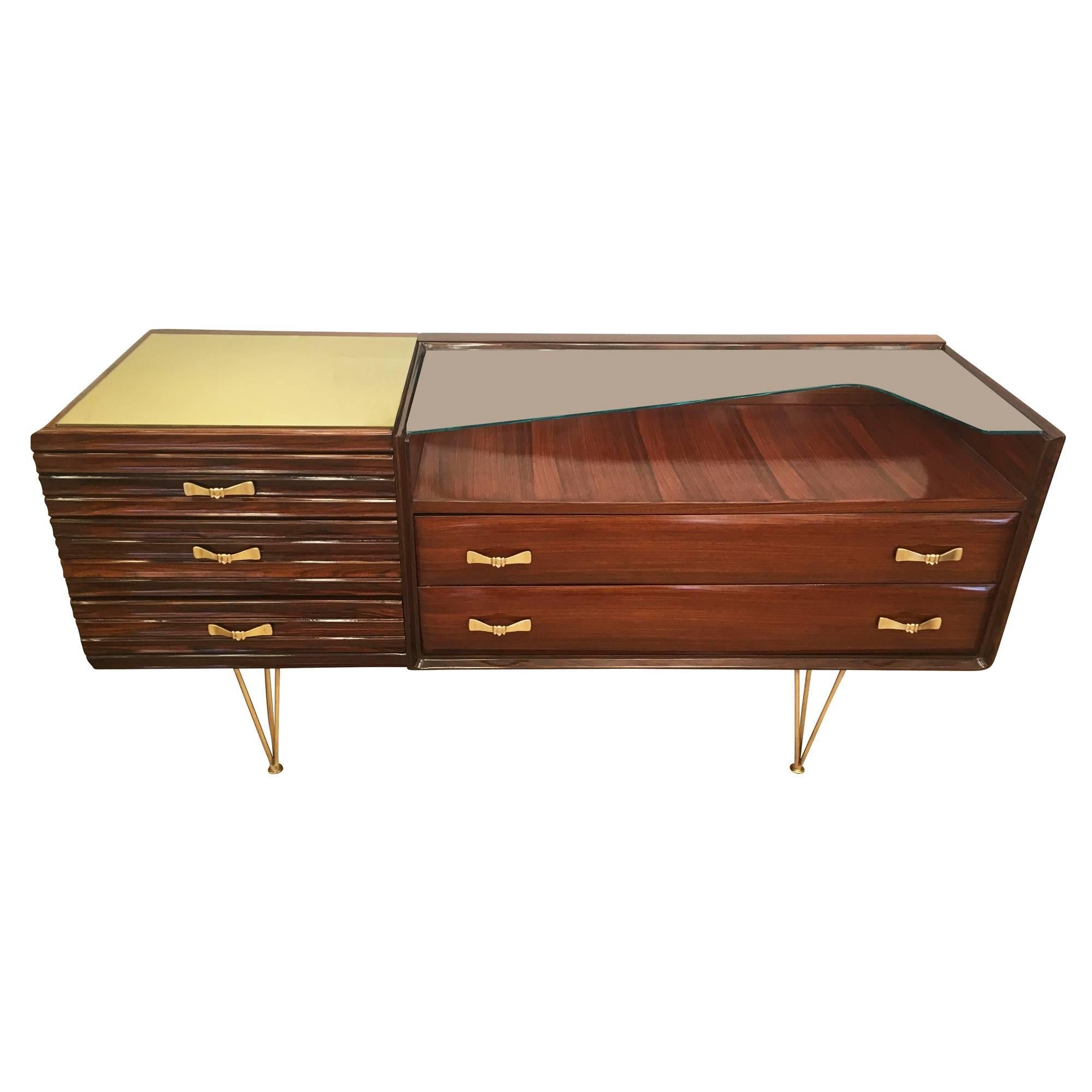 Attractive Italian dresser from the 1950 featuring some sculptural brass details. It has two glass tops: a square gold one to the left and a clear one on the right.

Available for viewing at Gaspare Asaro-Italian Modern in NYC