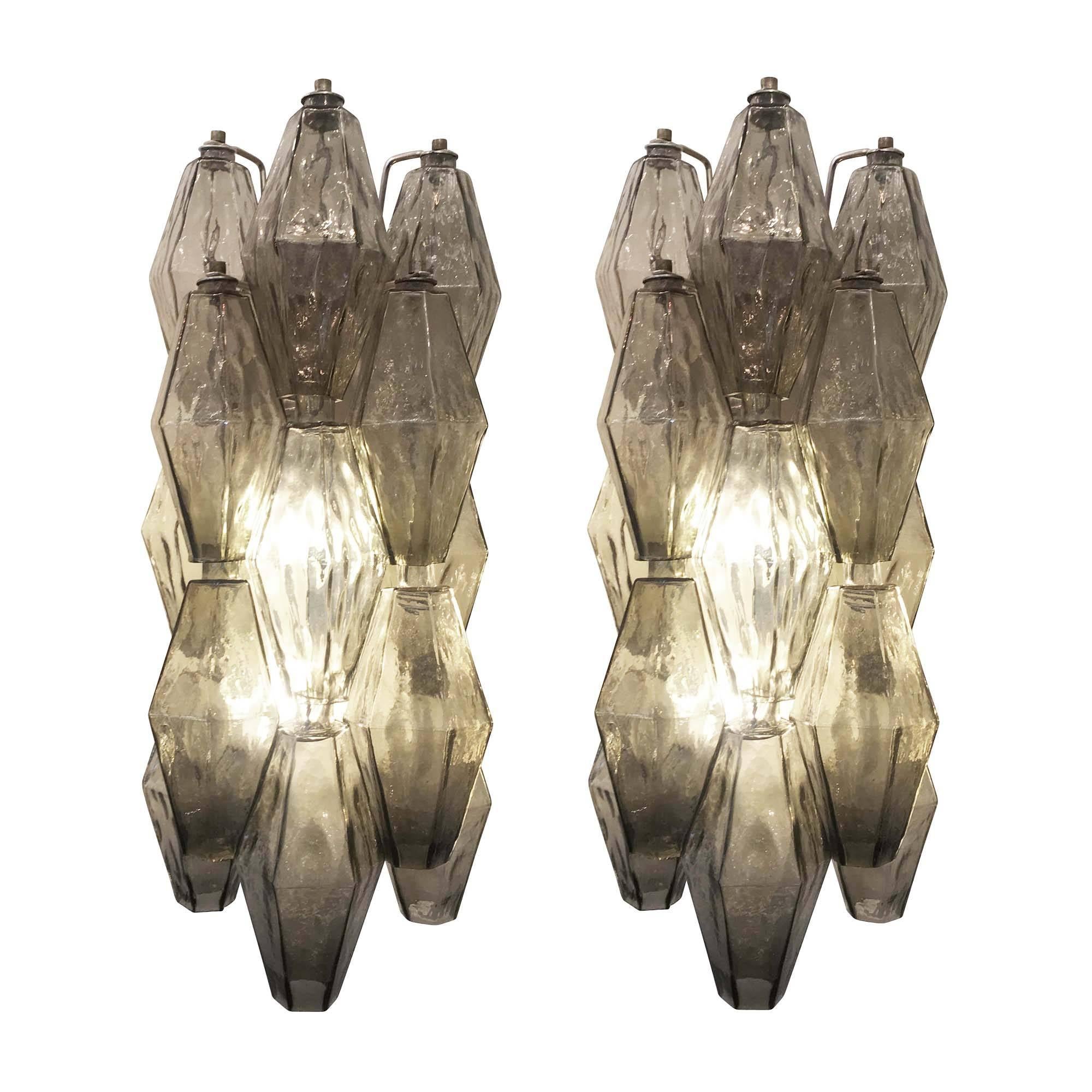 Large Venini sconces with grey iridescent polyhedral glasses. The frame of each is nickel and holds two candelabra sockets.