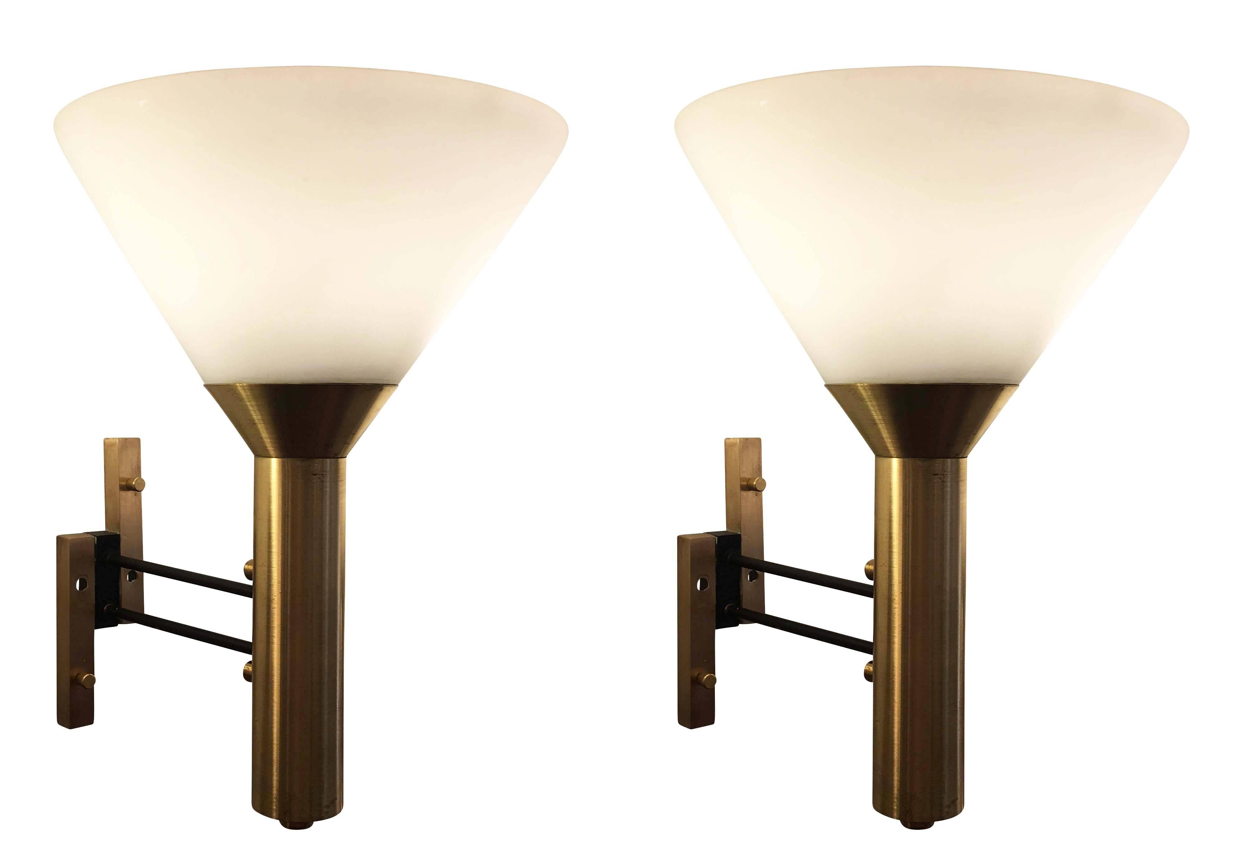 Elegant pair of funnel shaped Stilnovo wall lights. The glass is frosted white and the frame is brass and lacquered black. Each holds one regular socket.