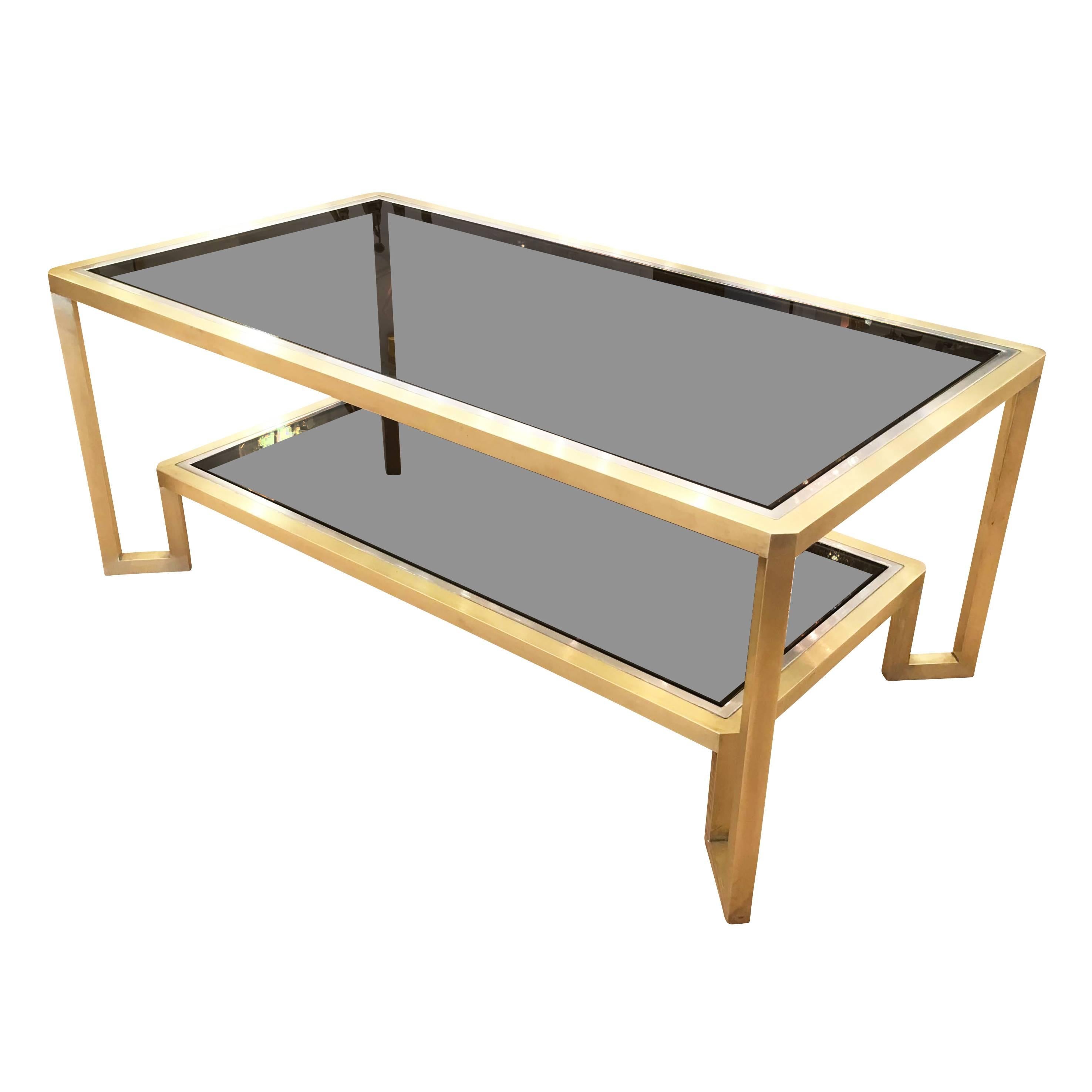 Satin brass coffee table in the manner of Romeo Rega with nickel lining and two smoked glasses.
