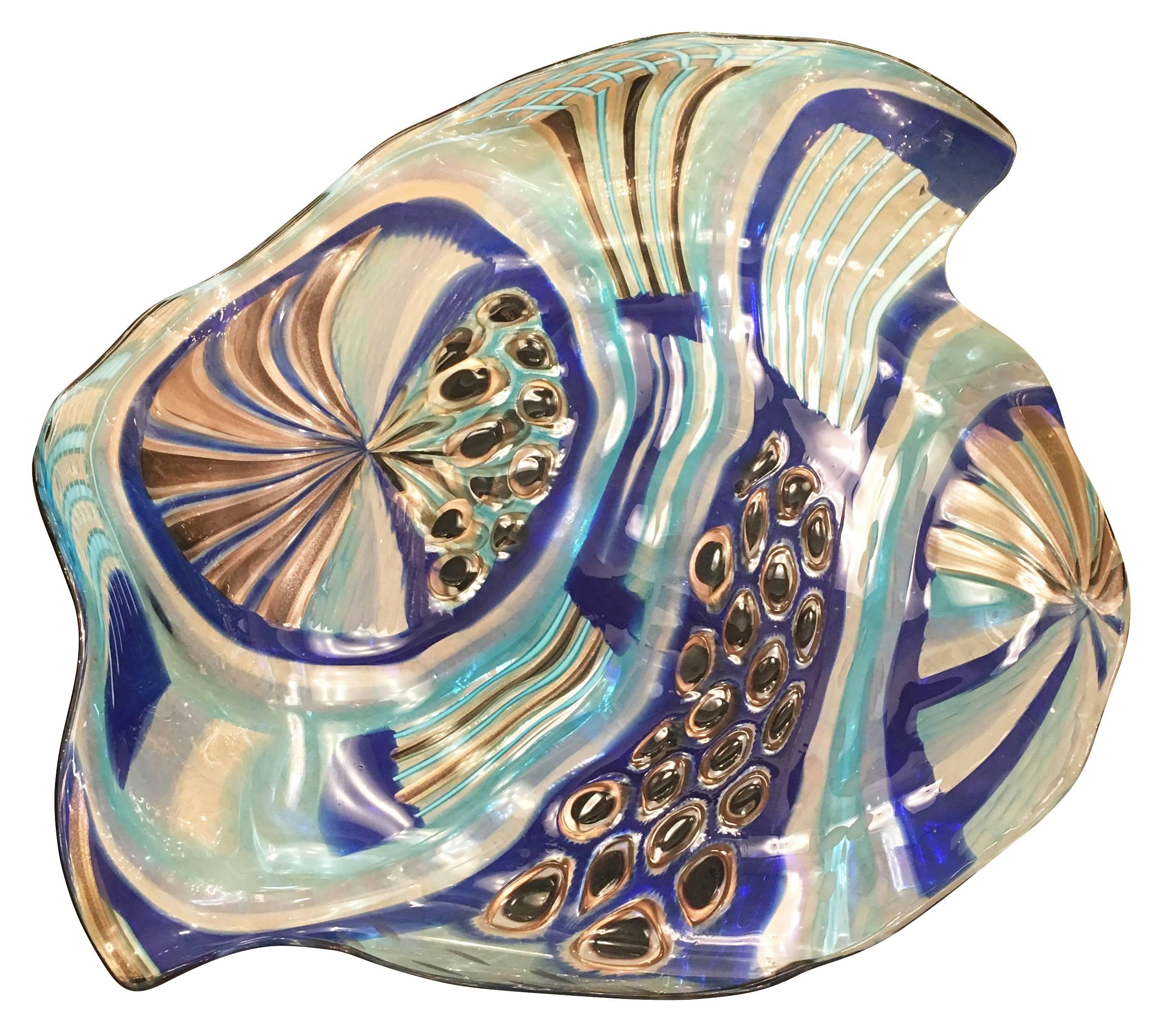 Colorful Murano glass centrepiece hand blown in an organic shape. The base is made of clear faceted glass.
