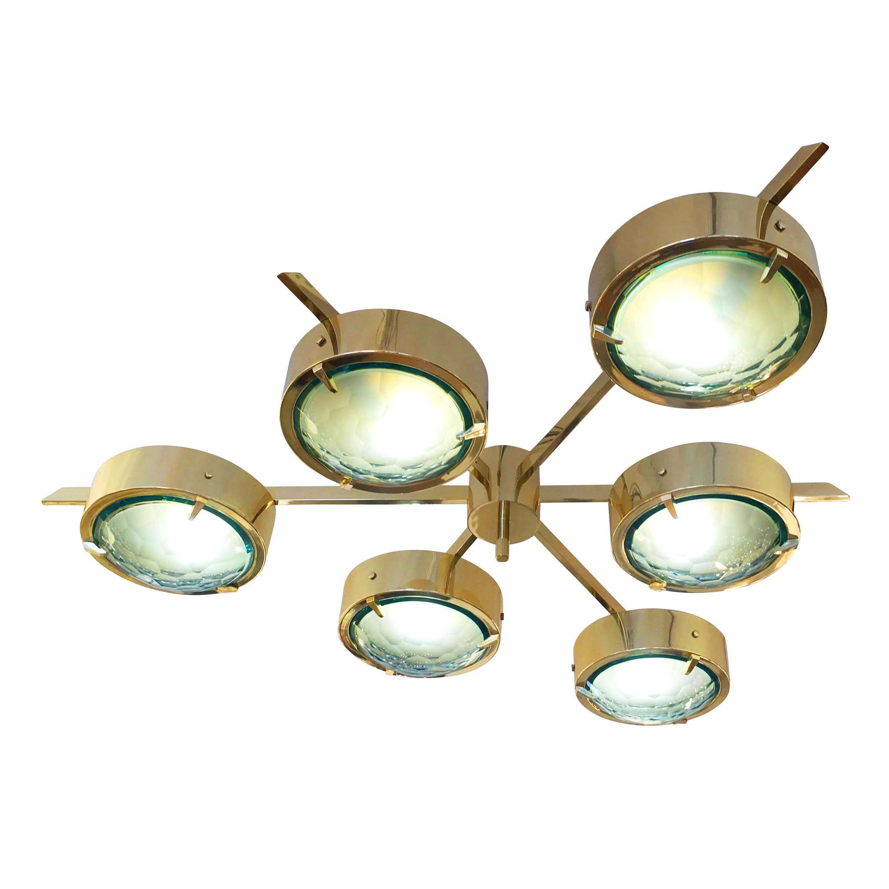 Stunning flush mount chandelier designed in collaboration with Italian artist Fedele Papagni. It features six disks with green faceted glass bottoms on a brass frame. The glass is frosted on the inside providing a soft diffused light. Can be