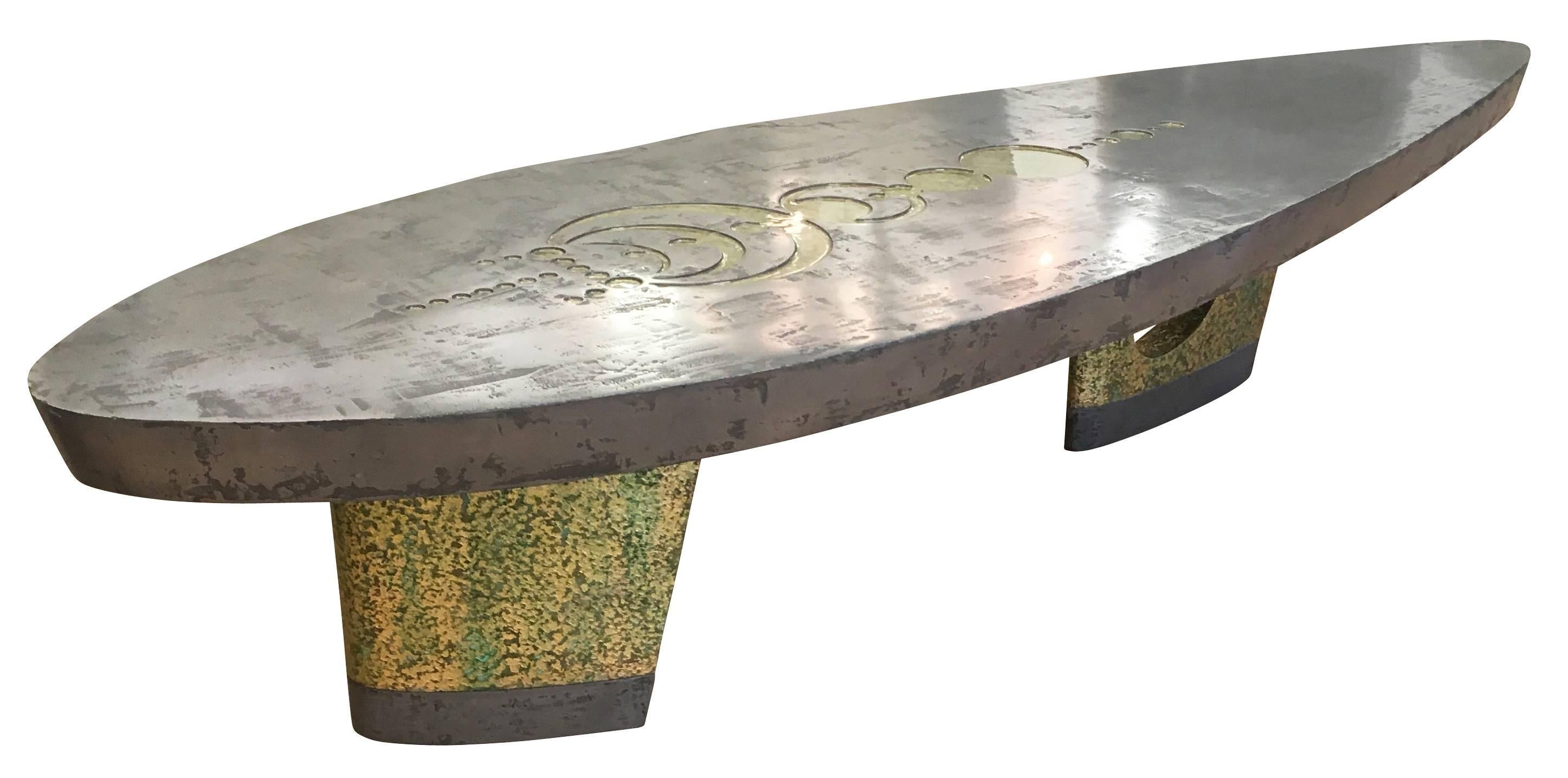 One of a kind contemporary coffee table made of metal and resin. The surf shaped top has a distressed feel that blends harmoniously with the organic base. The top also has engravings reminiscent of astrological symbols.

Measures: Width 79”

Depth
