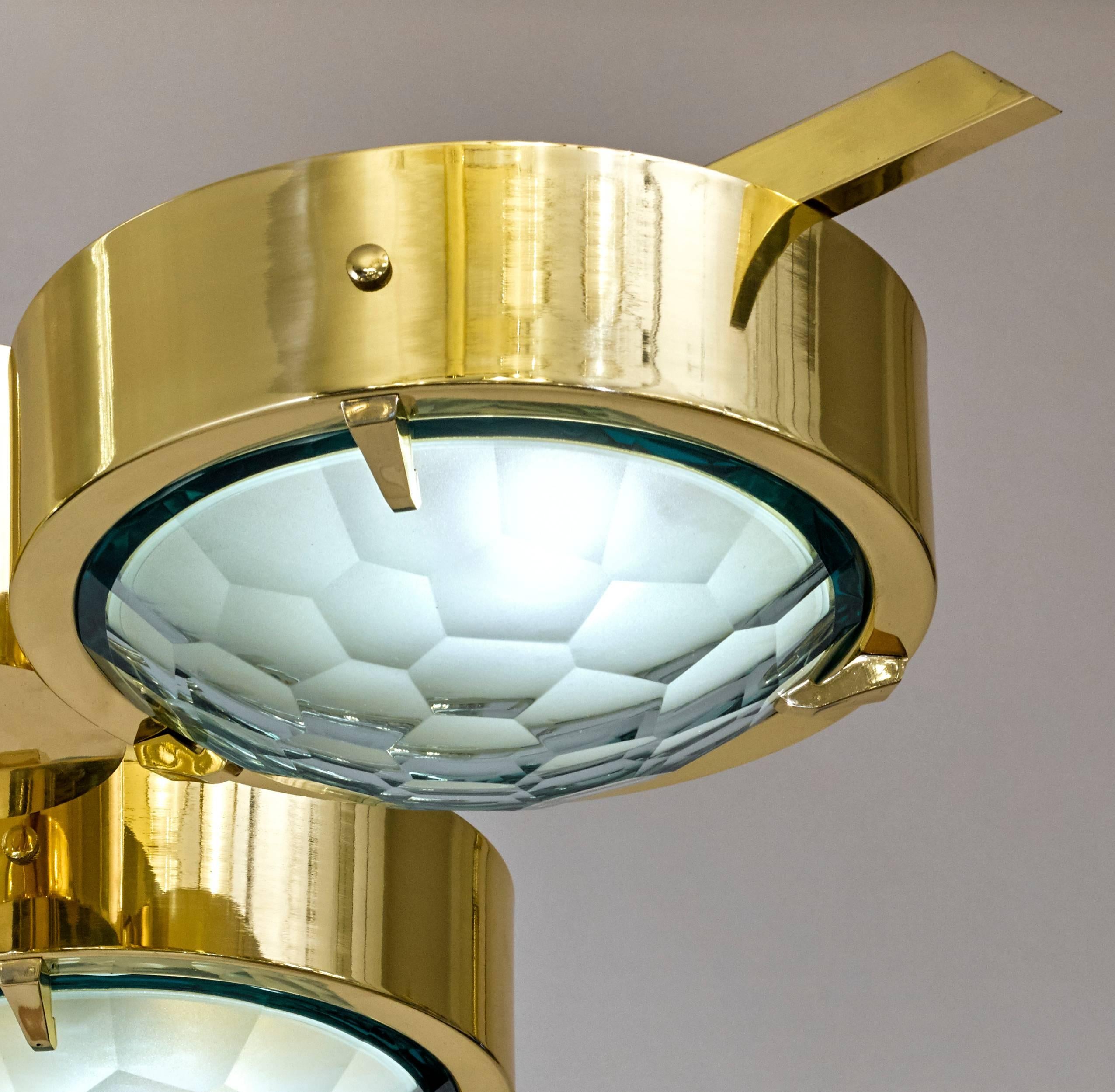 Stunning flush mount chandelier designed by Italian Artist Fedele Papagni for formA by Gaspare Asaro. It features three disks with green faceted glass bottoms on a brass frame. The glass is frosted on the inside providing a soft diffused light. Can