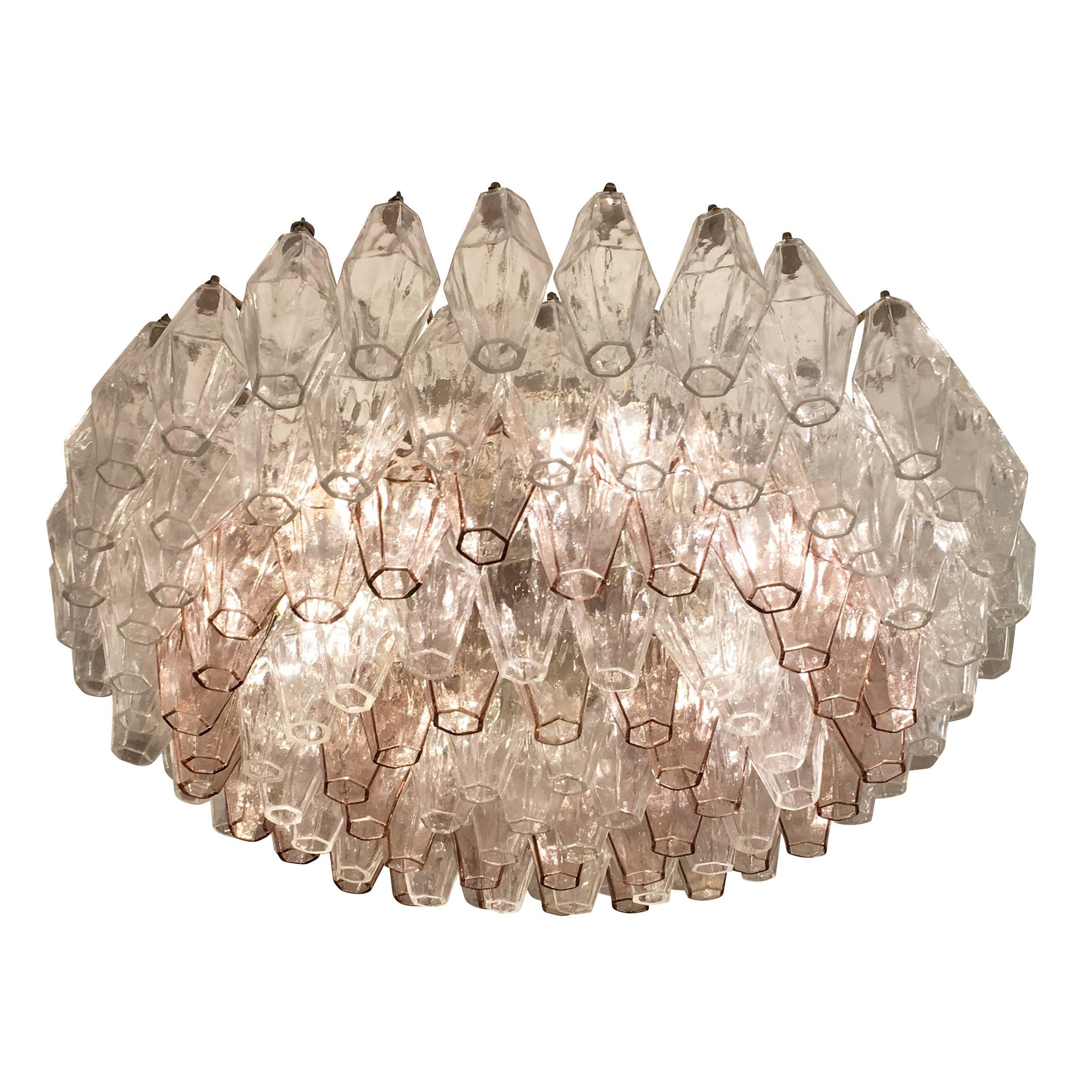 Original polyhedral chandelier made by Venini in the 1960s. This timeless Murano fixture has alternating rows of clear and light pink glasses on an off-white frame. Additional clear poliedri are available if needed. Can be semi-flush mounted or hung