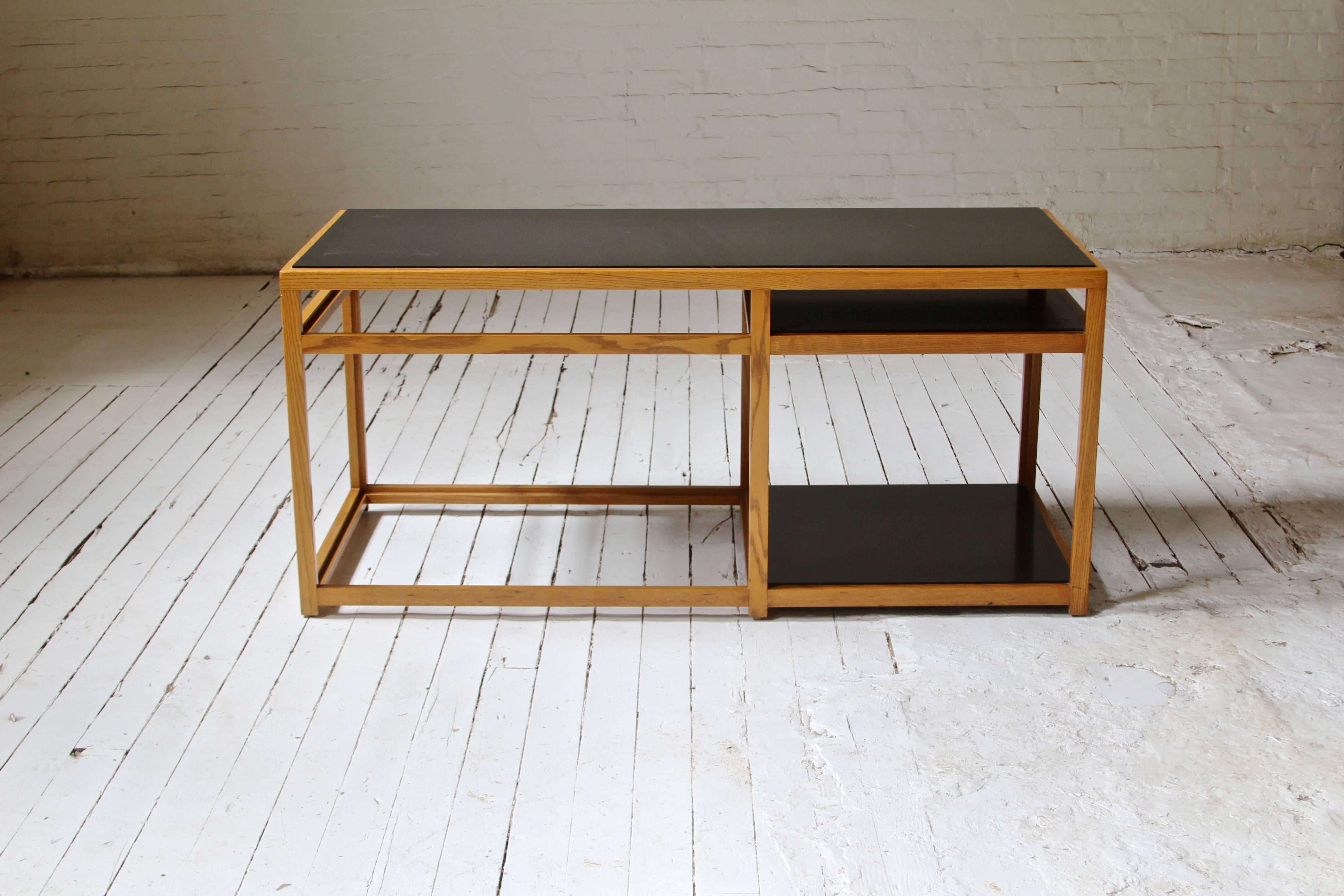 Geometrically conceived low table with solid ash construction and black laminate top, Edward Wormley for Dunbar, circa 1955.