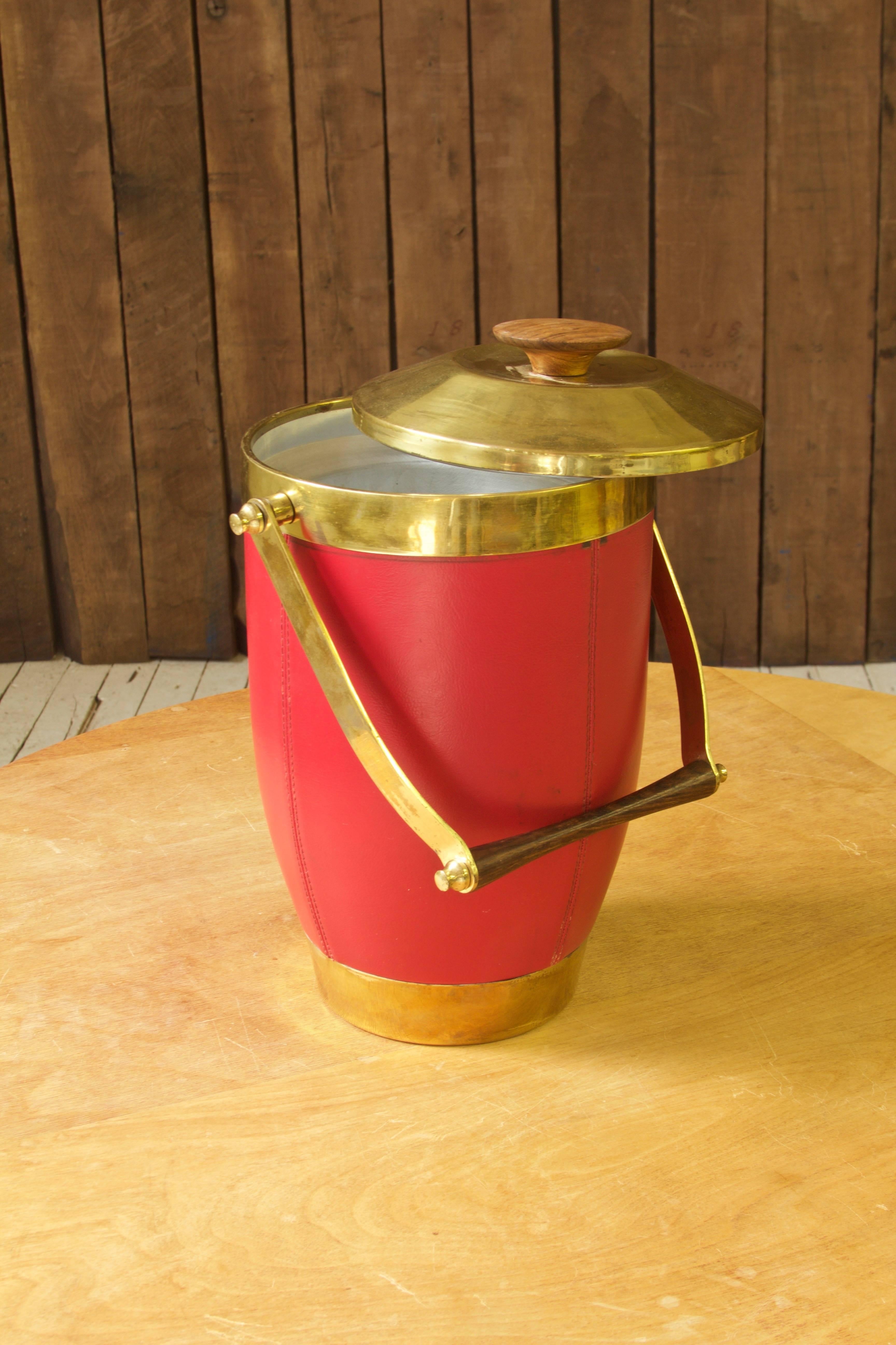 Double-chamber insulated ice-bucket featuring tempered aluminum chambers, brass accents, and Brazilian Rosewood handles. Made in Italy, circa 1970.