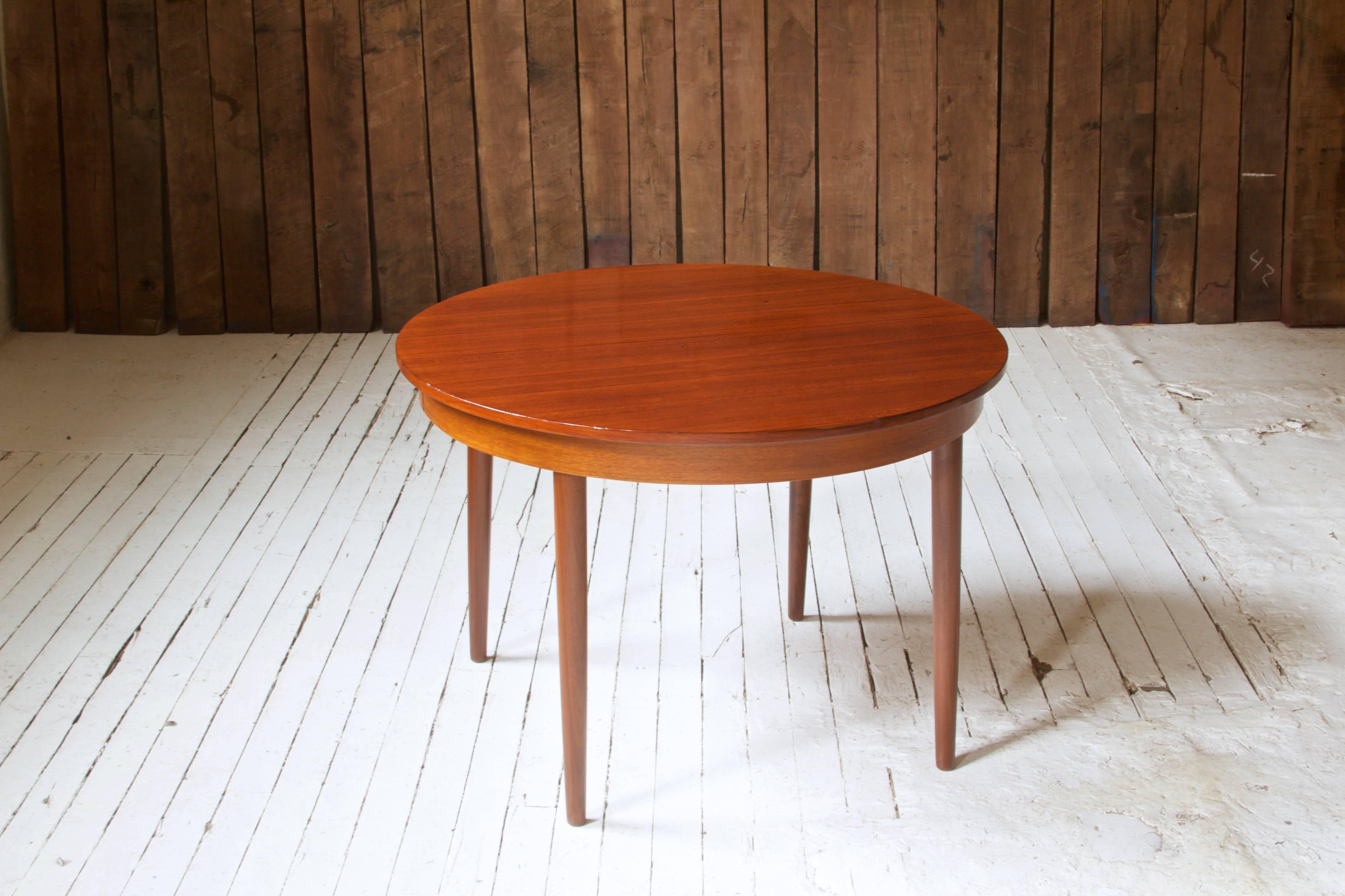 Lovely table by Hans Olsen for Frem Rojle with demountable legs and polished teak top. Manufacturer's mark to underside. Made in Denmark.