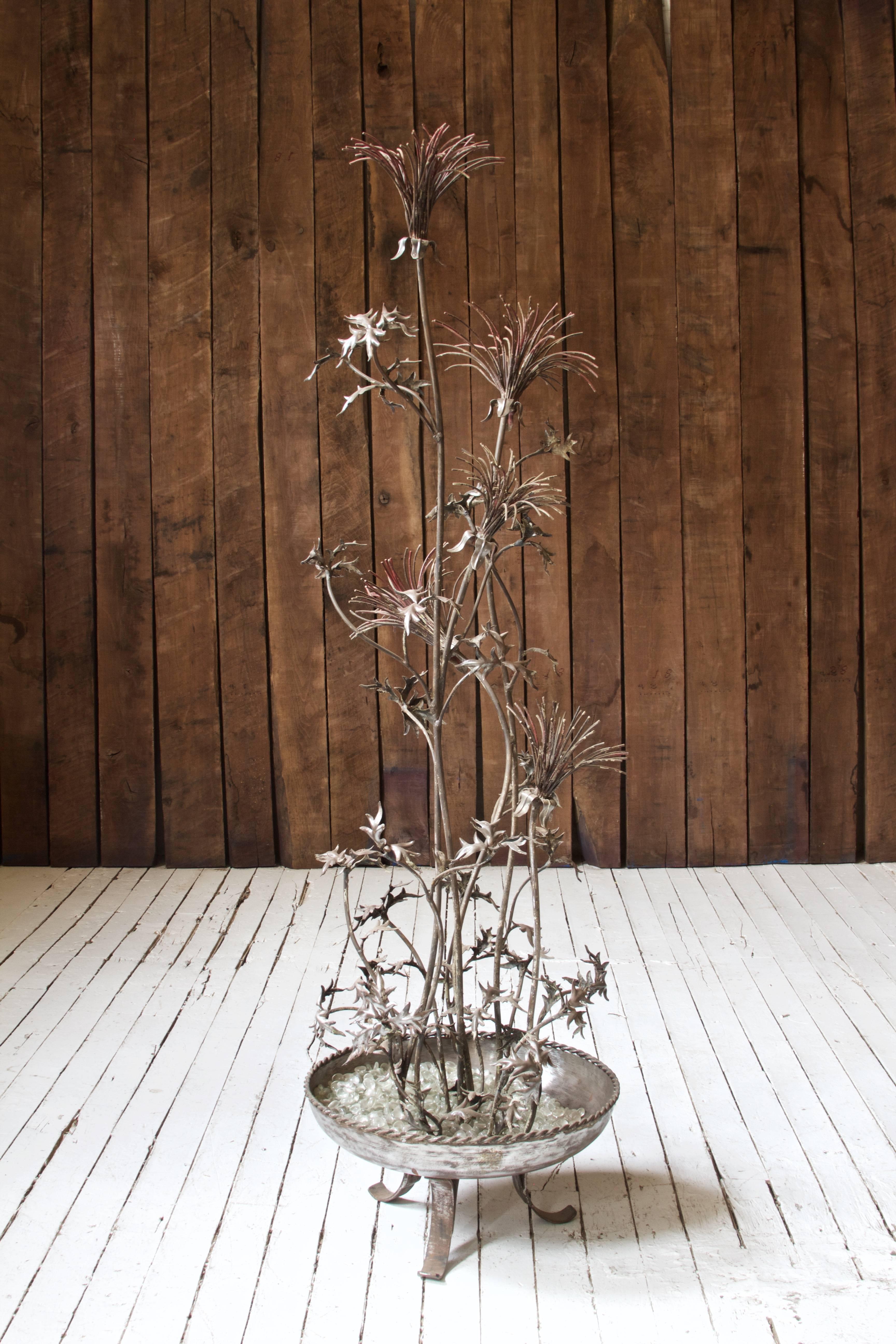 Exceptional artisan made metal French Renaissance style standing plant sculpture, 1940s. Original 'rouge' enamel tones remain on bronze; soft patina to metal throughout. Climbing hand-forged iron stems emerge from textured steel basin of