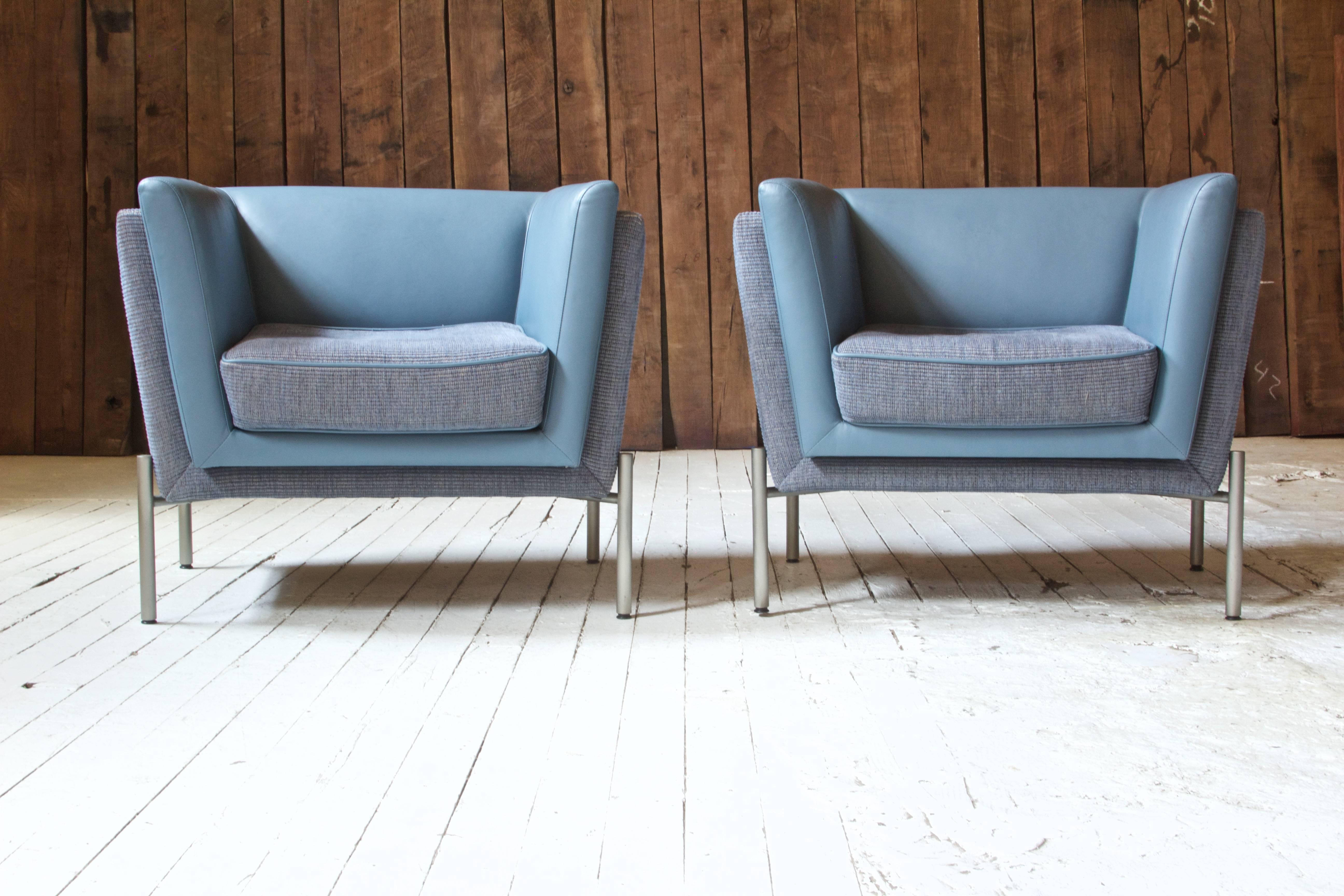 Great pair of comfortable and well made 'LAP' club chairs designed by Stanley Jay Friedman for Brueton, 1980s. This design features two-tone grey wool and blue leather upholstery supported by a polished stainless steel base with levelling glides.