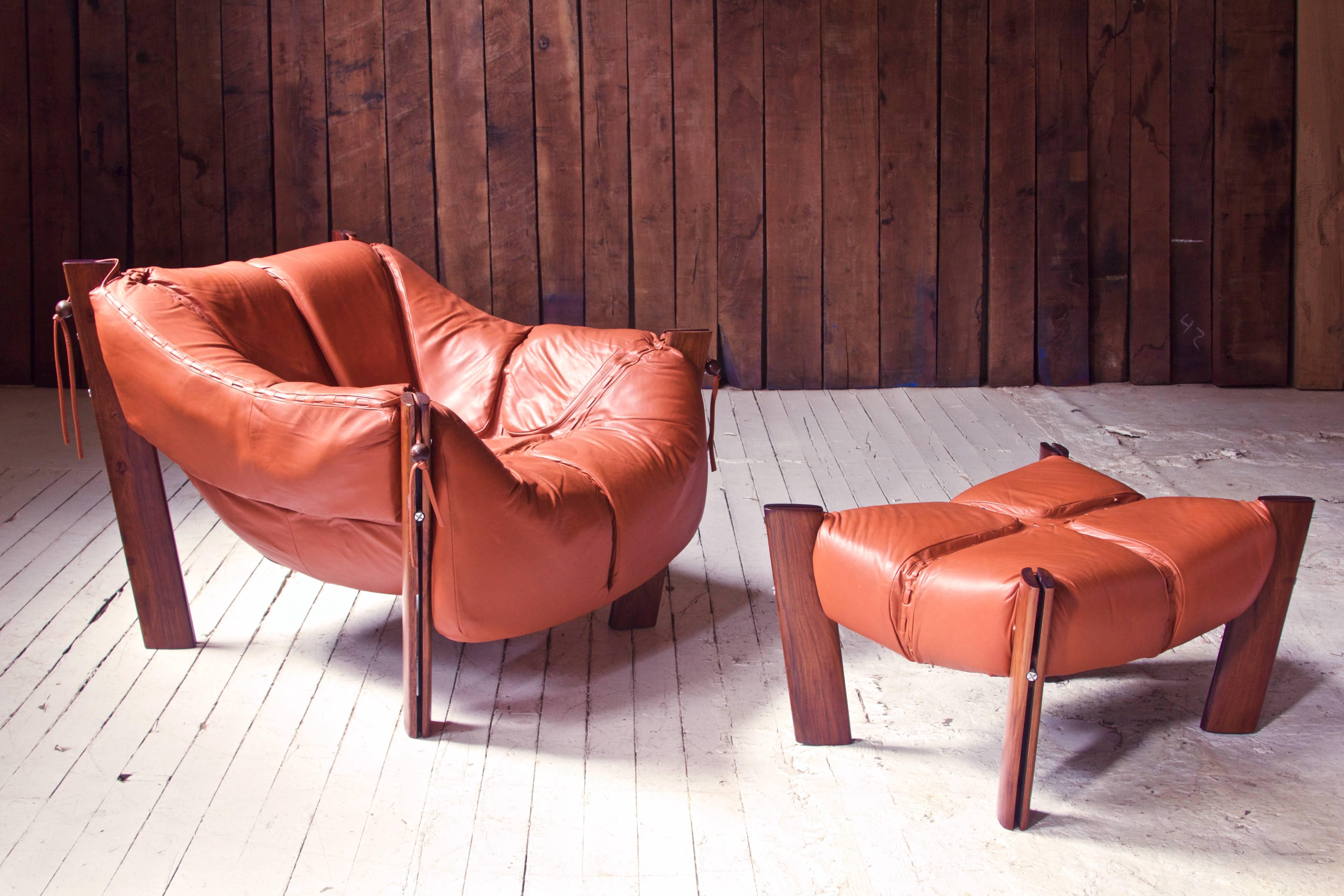 A well-preserved vintage Percival Lafer MP-211 Brazilian rosewood and leather lounge chair and ottoman made in Sao Paolo, Brazil by Lafer S.A Ind. e Com, circa 1975. This piece has come from the Carmel, NY estate of the original owner, has seen