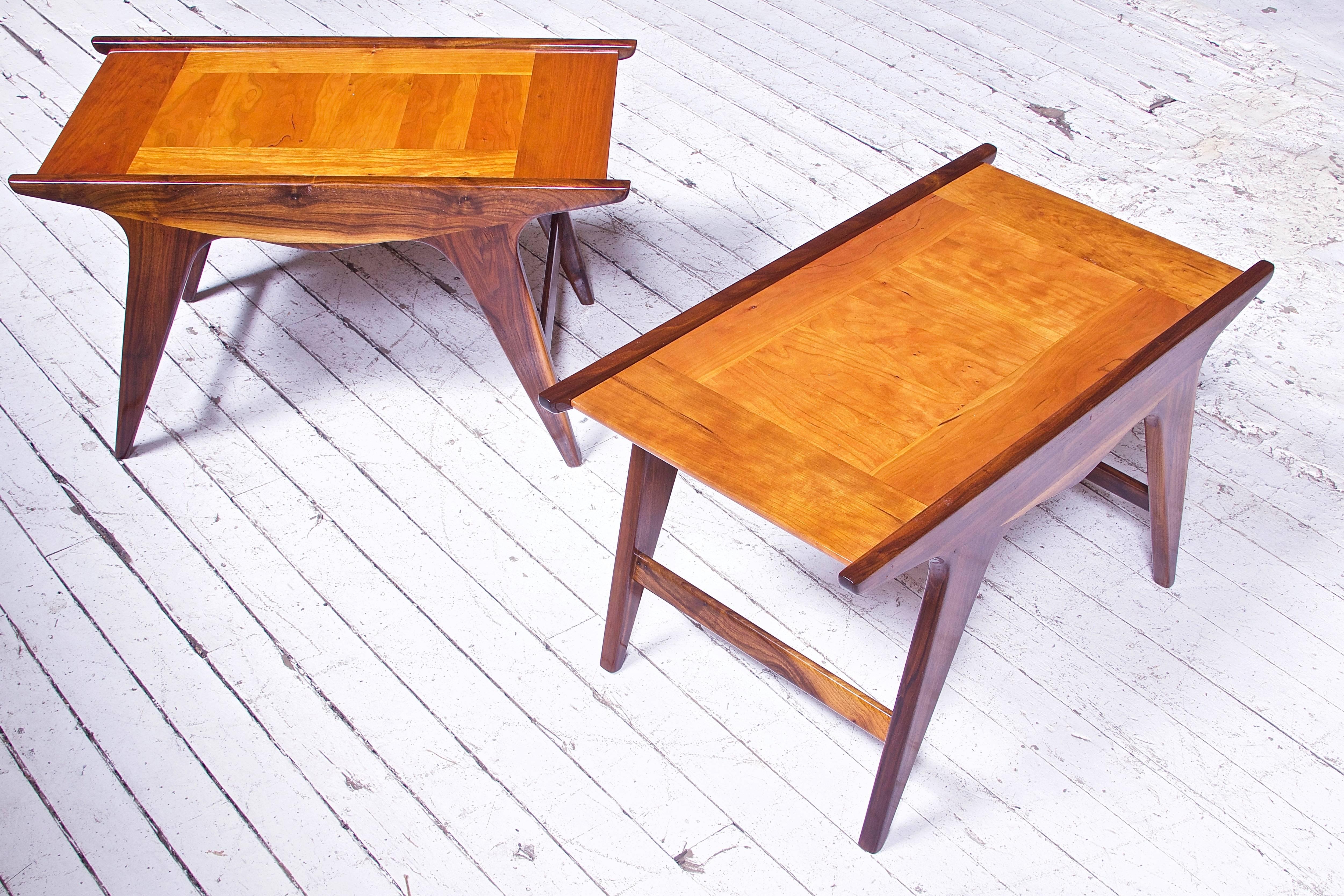 A pair of limited edition 'Tavolinetto' end tables in walnut and cherry designed by Angelo Montaperto, handmade by Montaperto Studios-2017. This particular form was inspired by Italian modern design of the 20th century, as well as the American