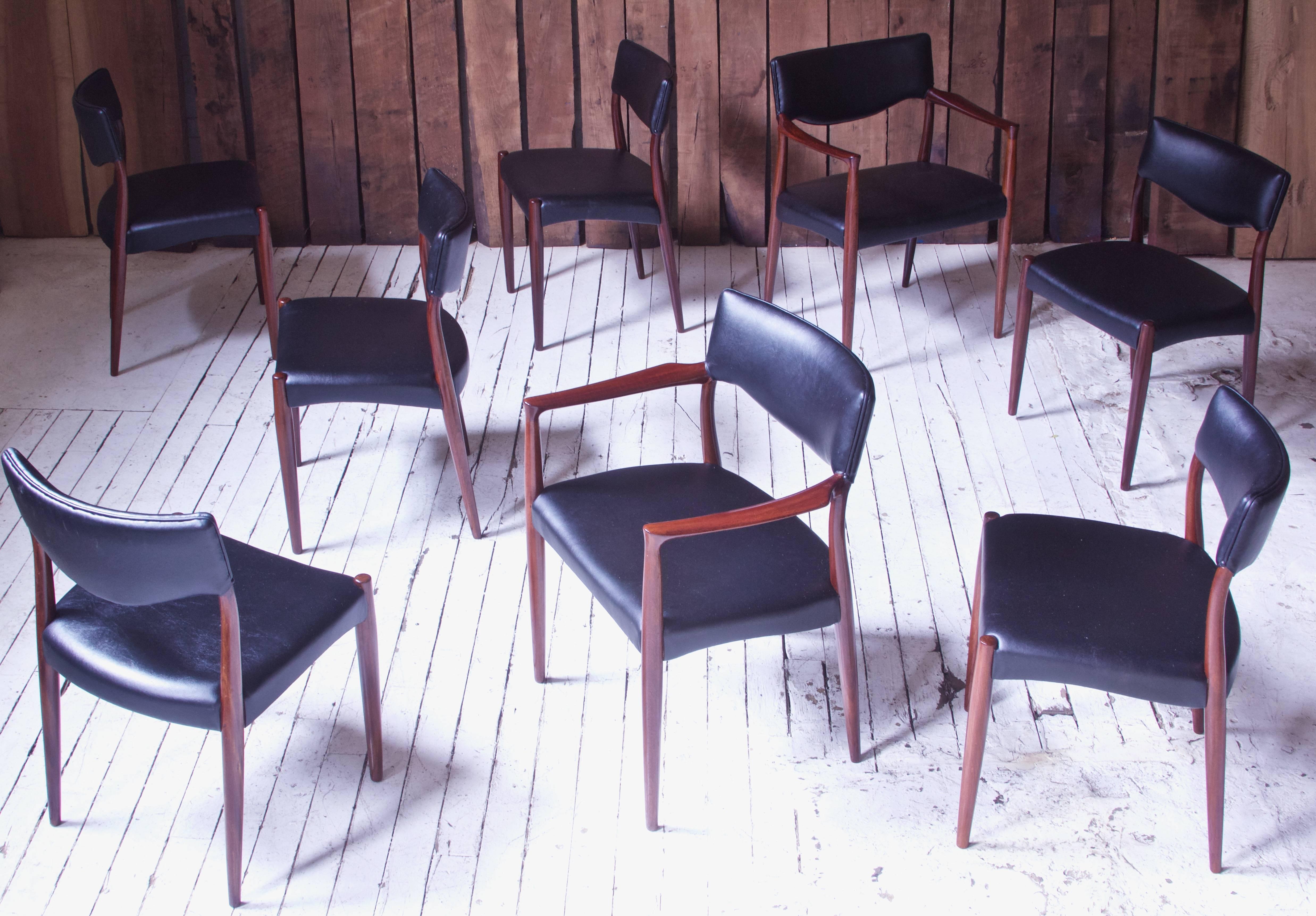 Stunning complete and original set of eight dining chairs, two of which are armchairs, designed by the prolific and multi-talented Danish design duo of Aksel Bender Madsen & Ejner Larsen, 1952; manufactured by Willy Beck. Excellent vintage