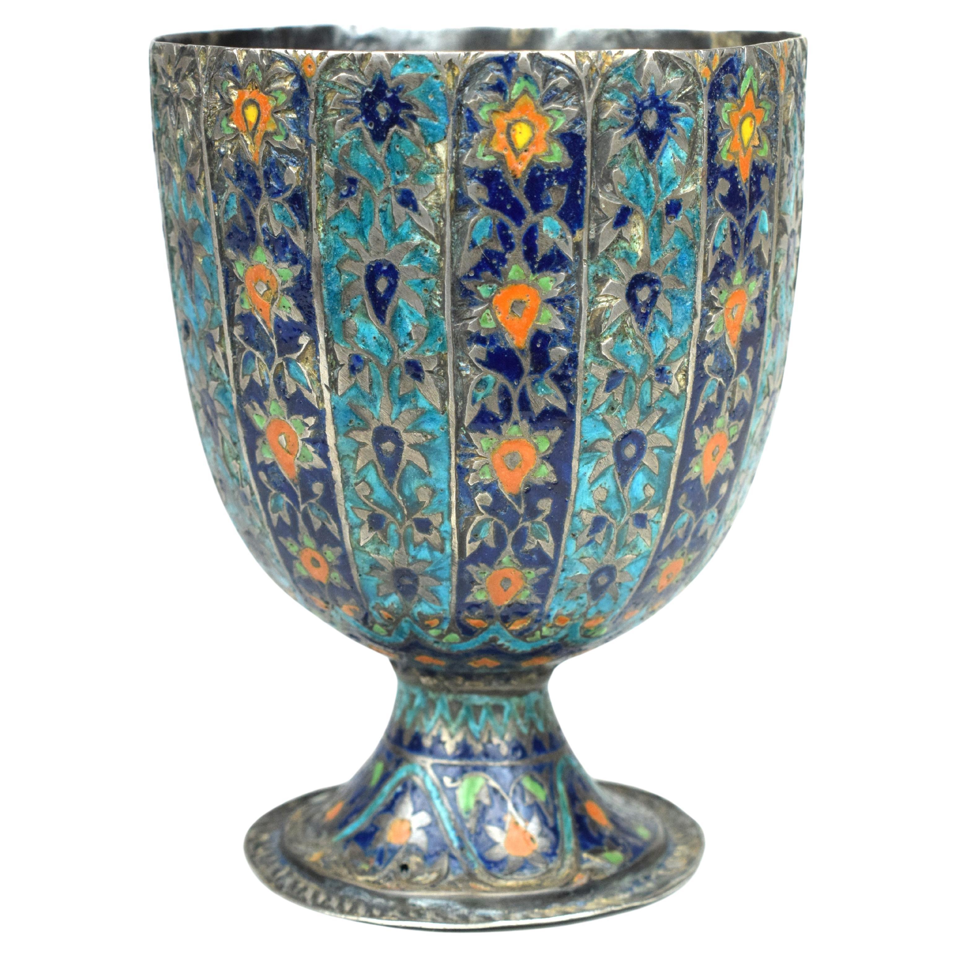 This Mughal Meena Silver Ceremonial Goblet from the 18th century is a masterpiece that reflects the opulence and artistic sophistication of the Mughal Empire. This goblet is adorned with exquisite meenakari or enamel work, a traditional technique
