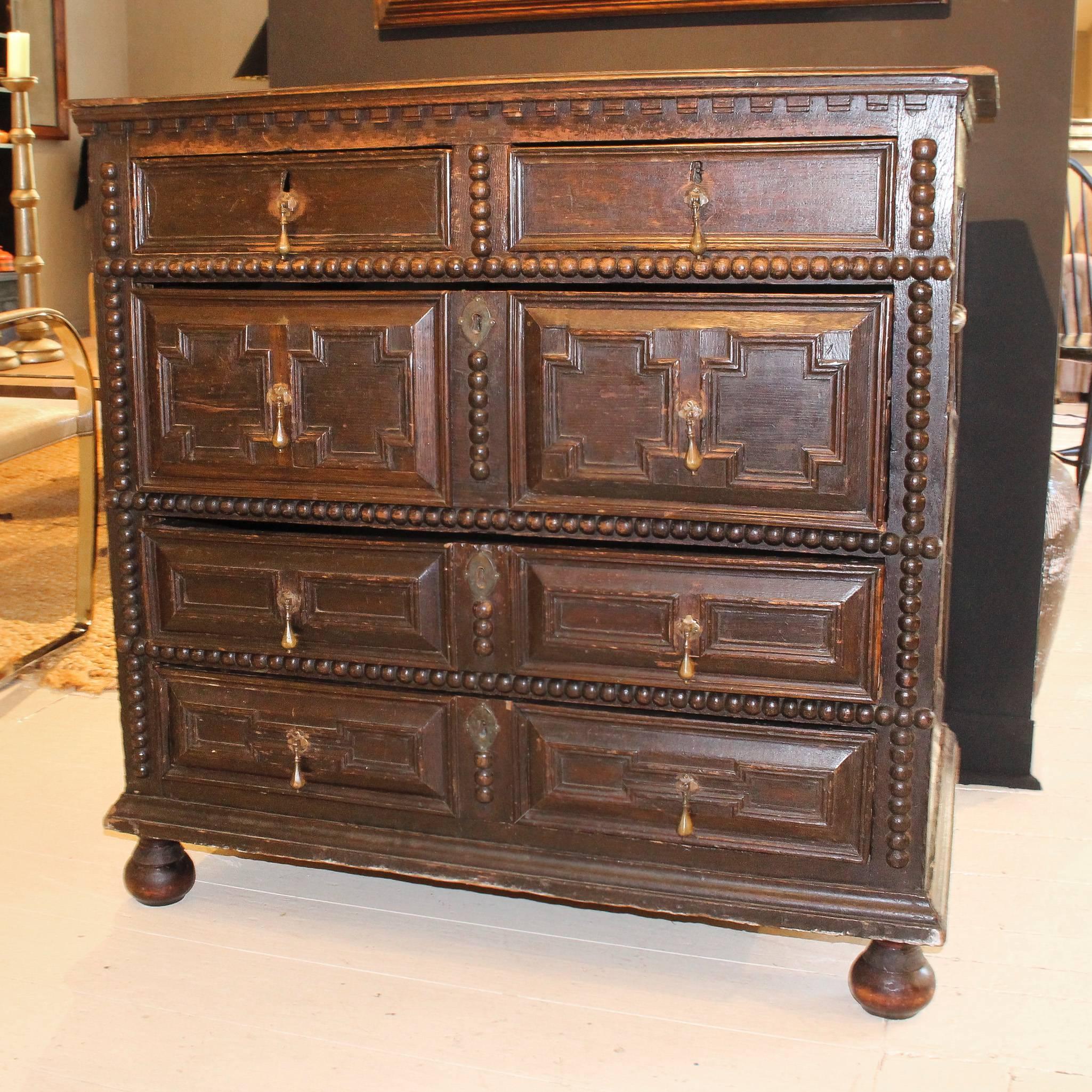 Period 17th-Early 18th century five-drawer pilgrim chest, Probably from Massachusetts or New Hampshire. Chest has dentil moulding and applied decorative turnings that are typical of furniture made in the Plymouth area.