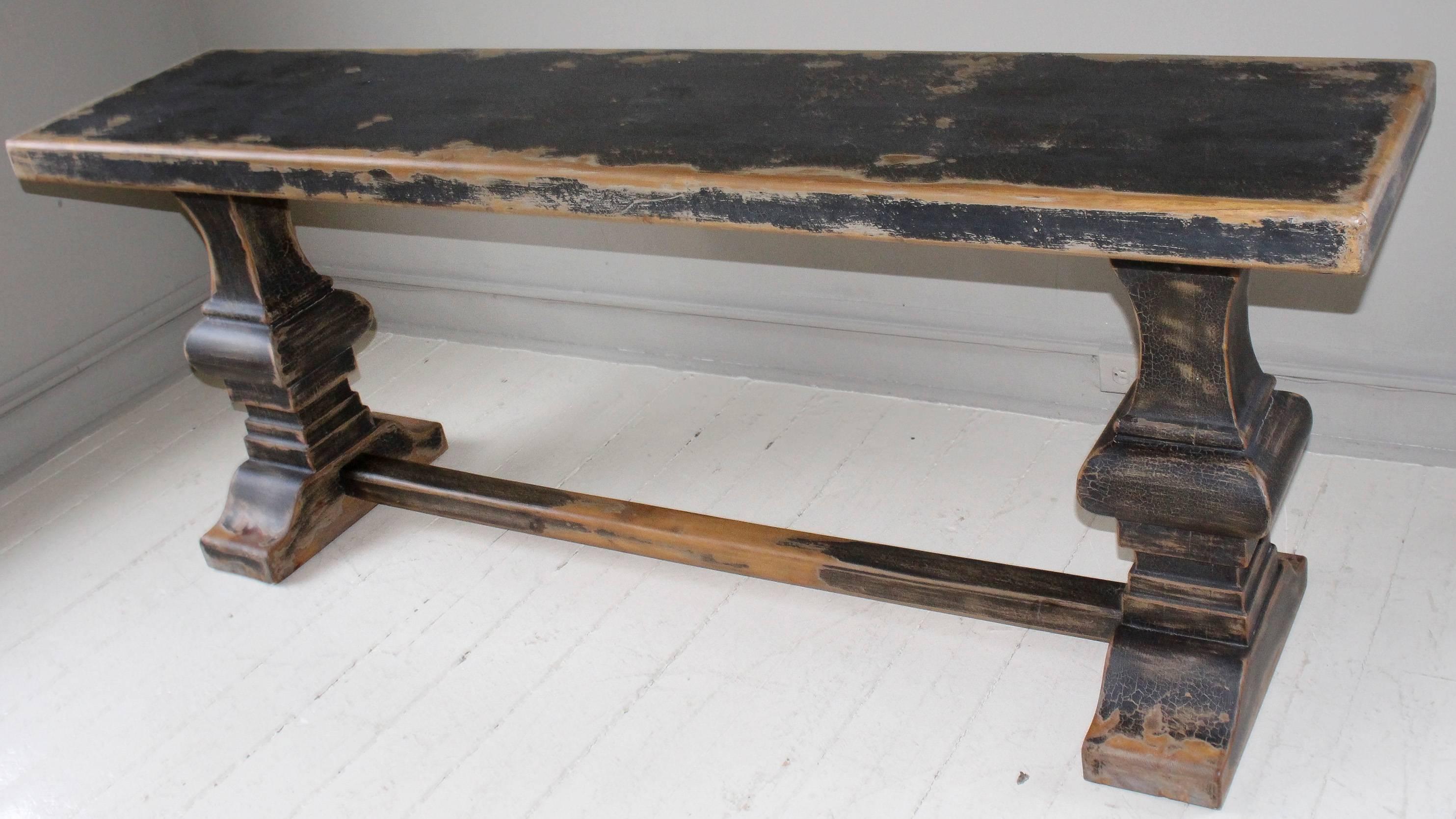 Elmwood trestle console table, 21st century, Southeast Asian, with distressed ebonized finish.