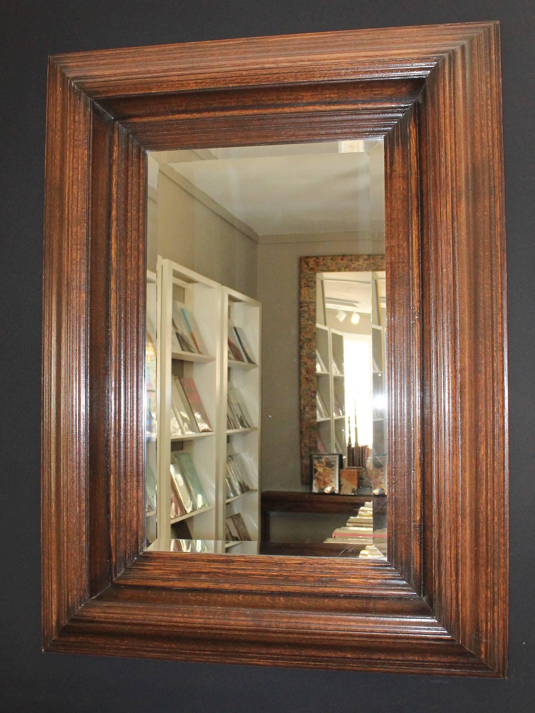 Magnificent 19th century oak framed mirror with impressive deep stepped moulding.
