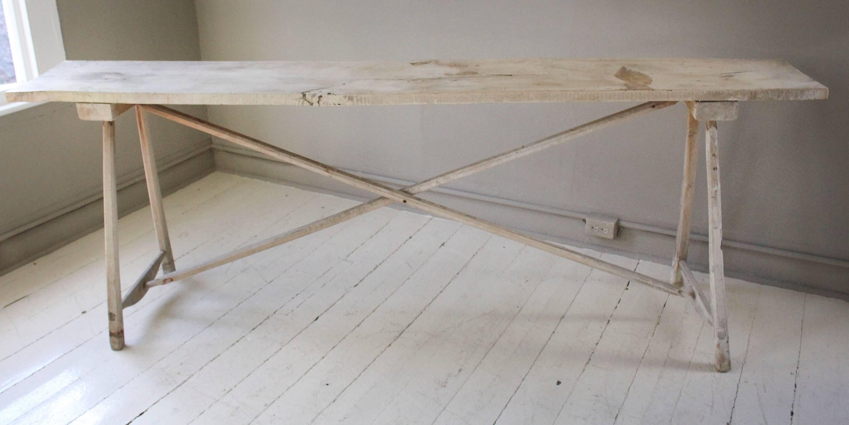 Belgian 20th century bleached wood console table with distinctive X-stretcher base.
