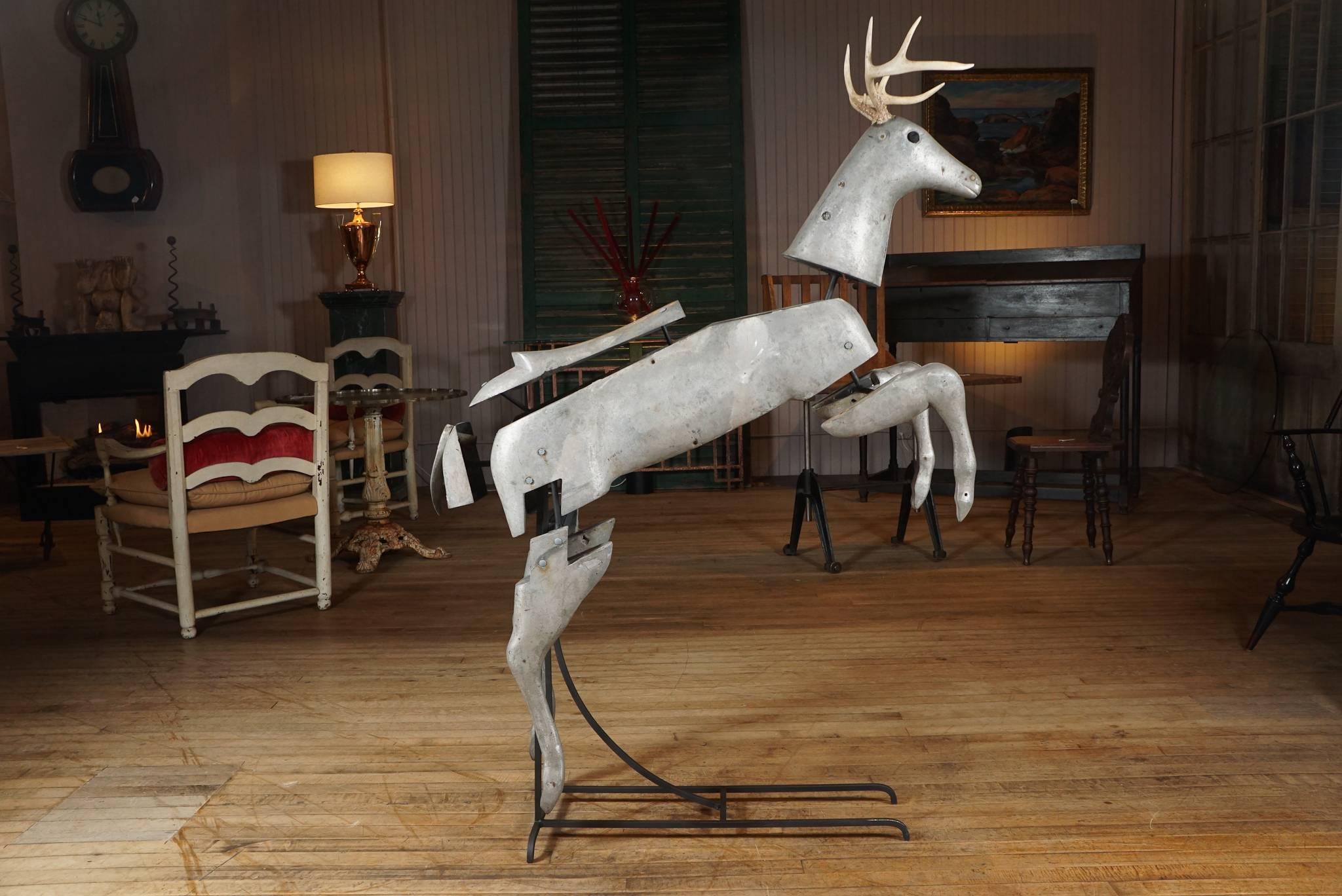 1930s aluminum pieces of a carousel deer, assembled on iron skeleton, real antlers, one original eye while the other is a big button.