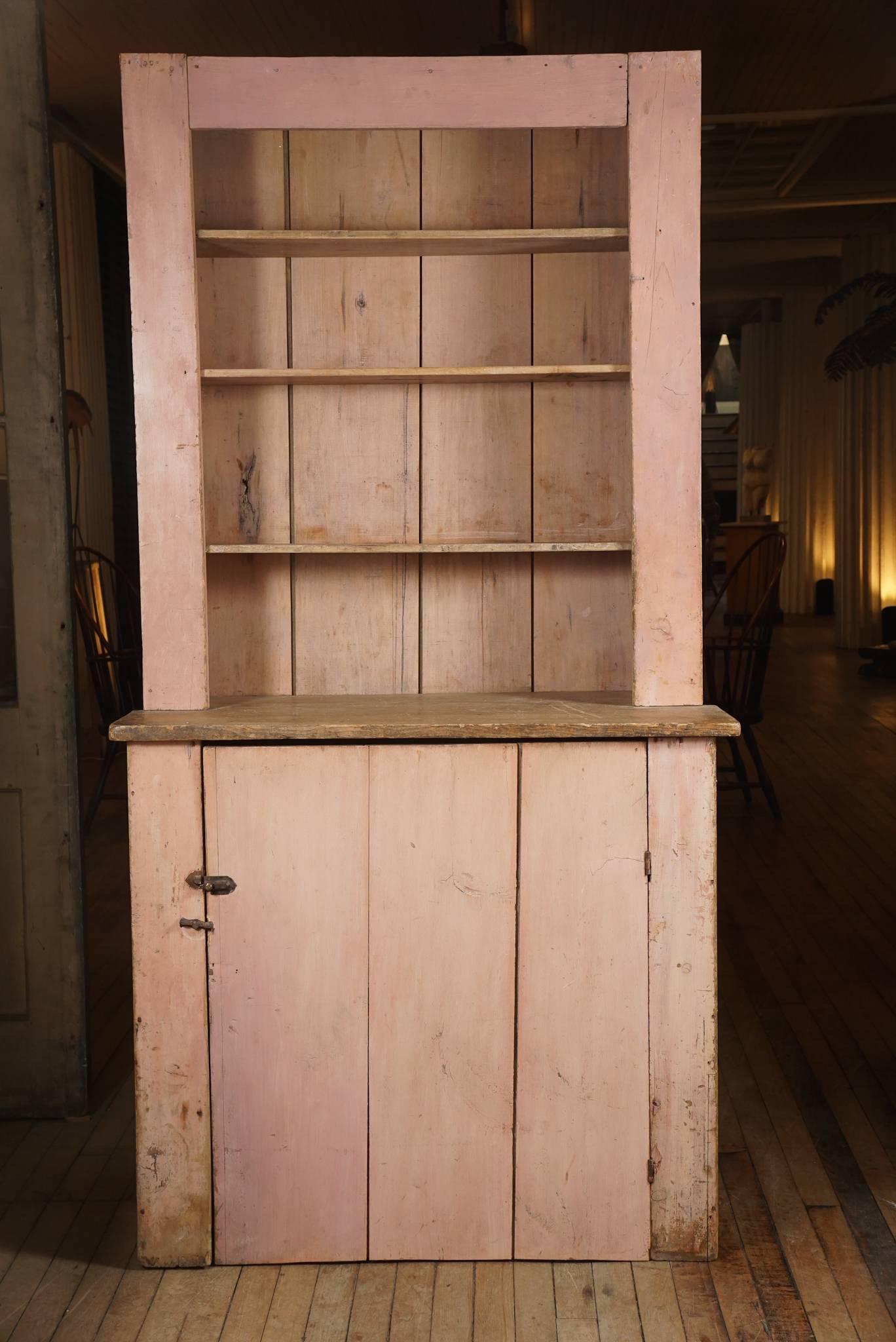19th century step back cupboard, in the most amazing original pink wash surface - never painted dry work surface - thin board construction - square nails - batten door.