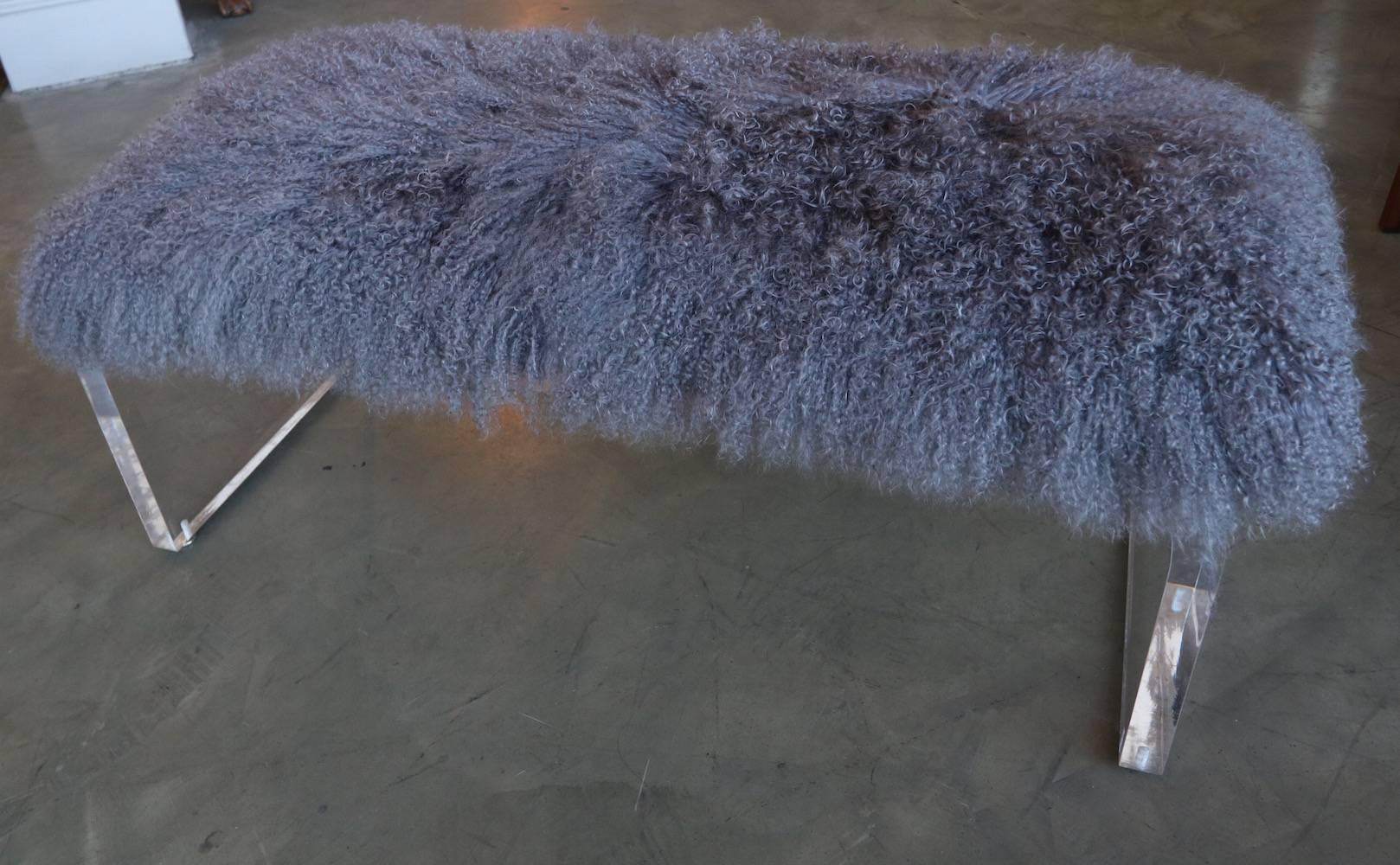 1970s acrylic bench with removable cushion upholstered in grey Mongolian sheepskin.