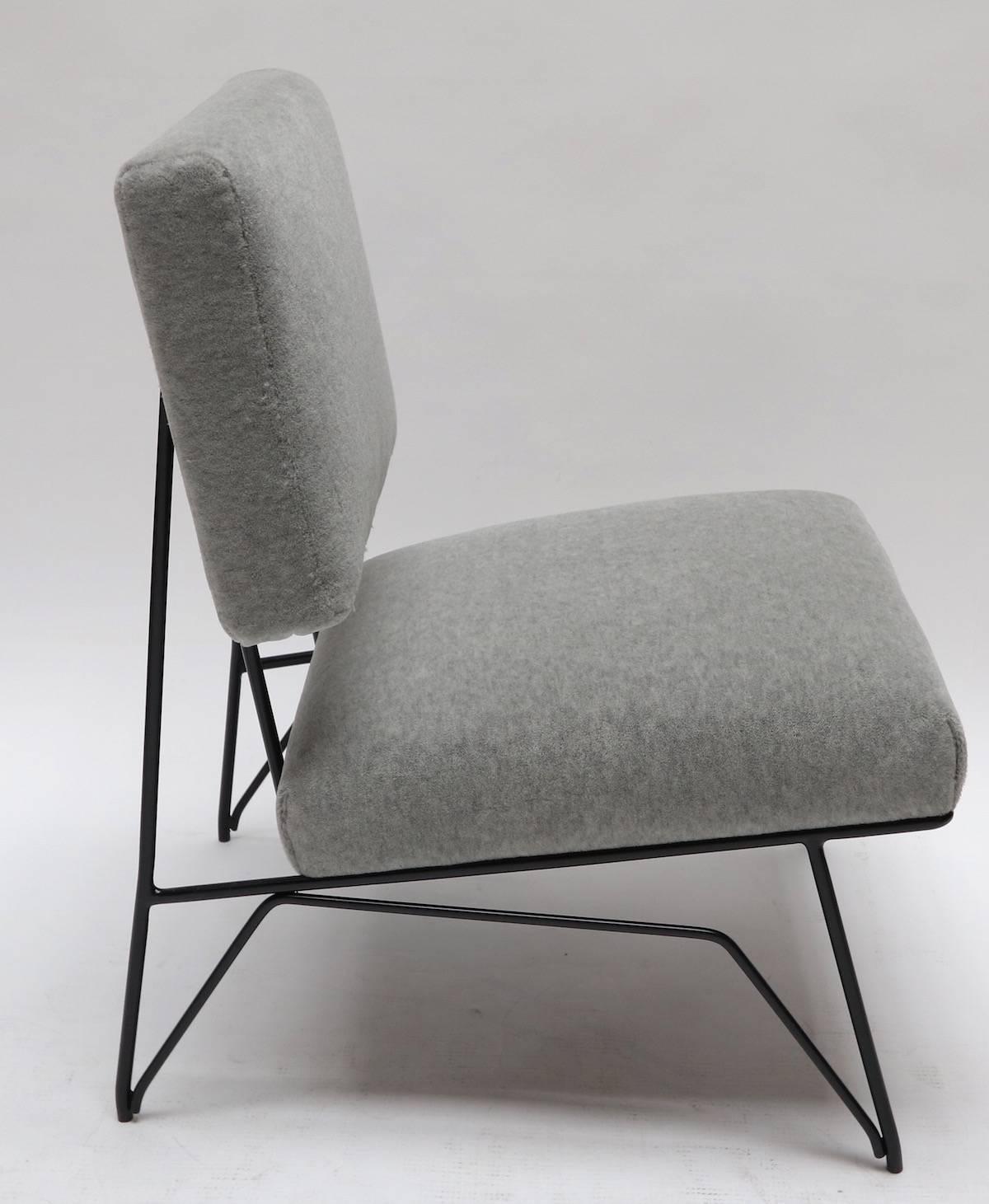 Pair of custom 1960s style slipper chairs with black metal frame upholstered in gray alpaca. Made in Los Angeles by Adesso Imports.