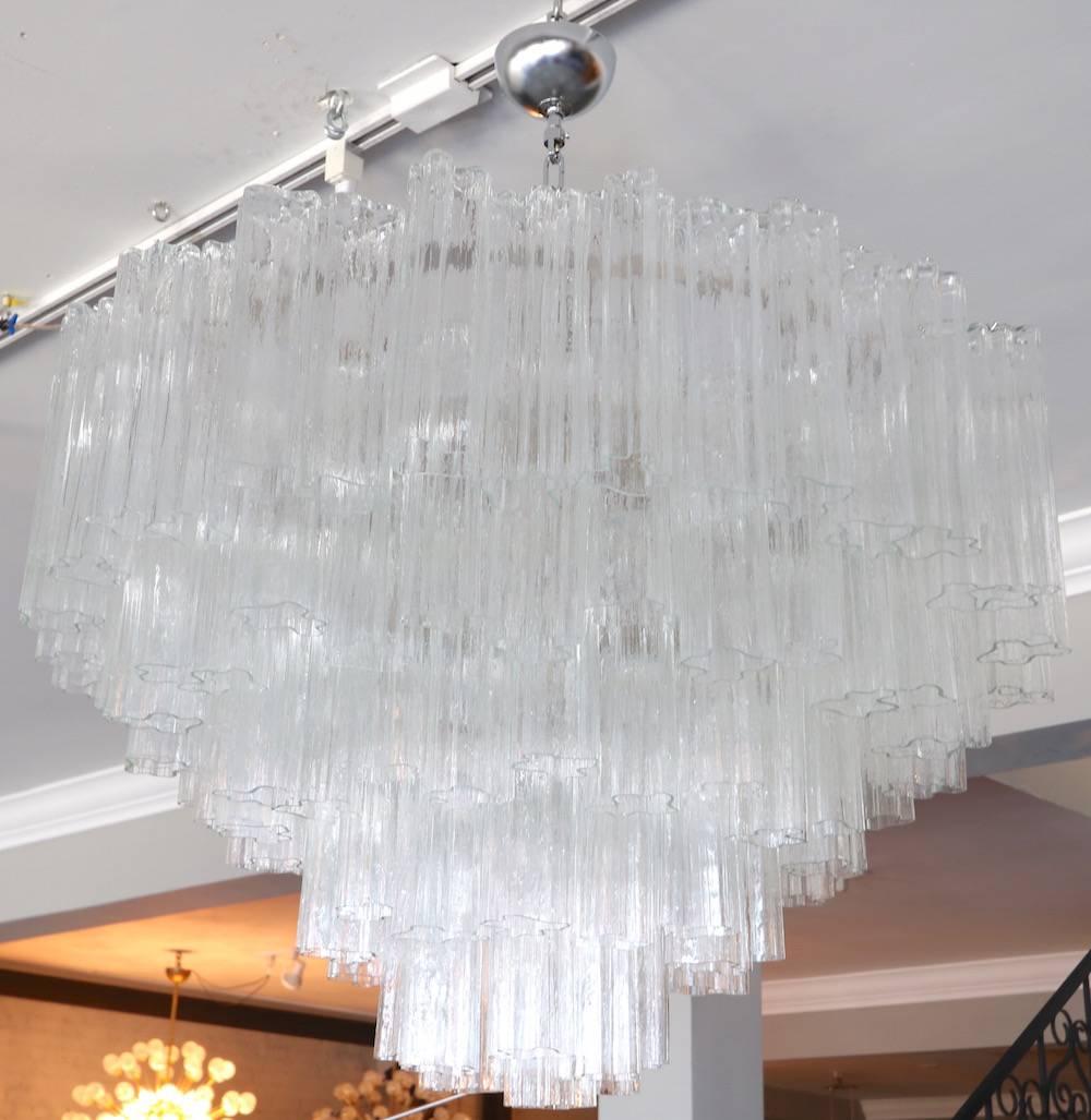 Pair of 1970s tiered Mazzega chandeliers with 121 clear glass pieces. Completely restored and rewired. Priced individually.