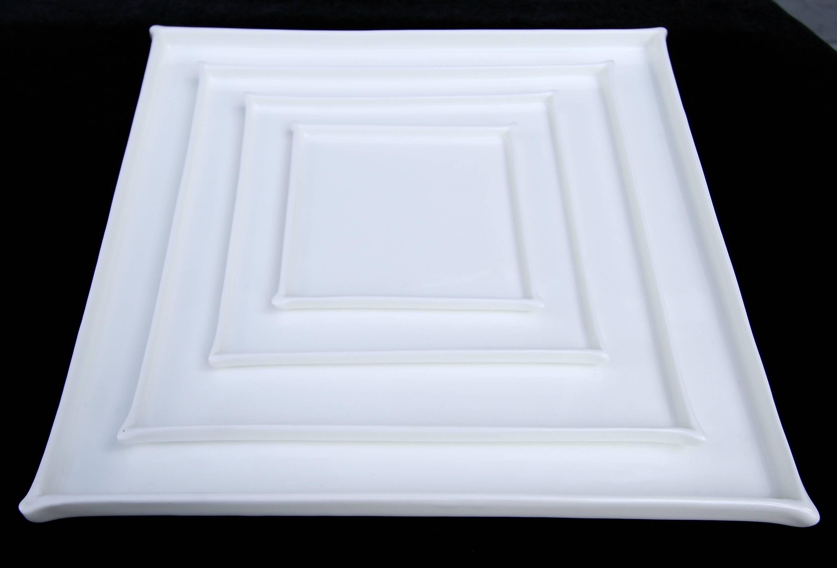 Square white bone China plates by Ann Van Hoey for the line enchanting geometry for Serax. Priced individually.

Measures: Mini $22 (4