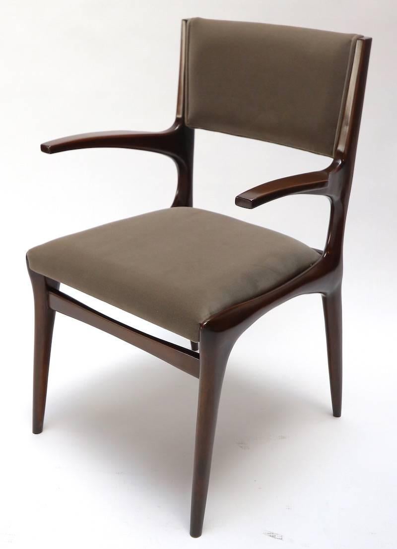 Set of 11 beautifully sculpted 1950s Carlo de Carli dining chairs with arms, newly restored and upholstered in gray Belgian velvet. Note that the set can be split.