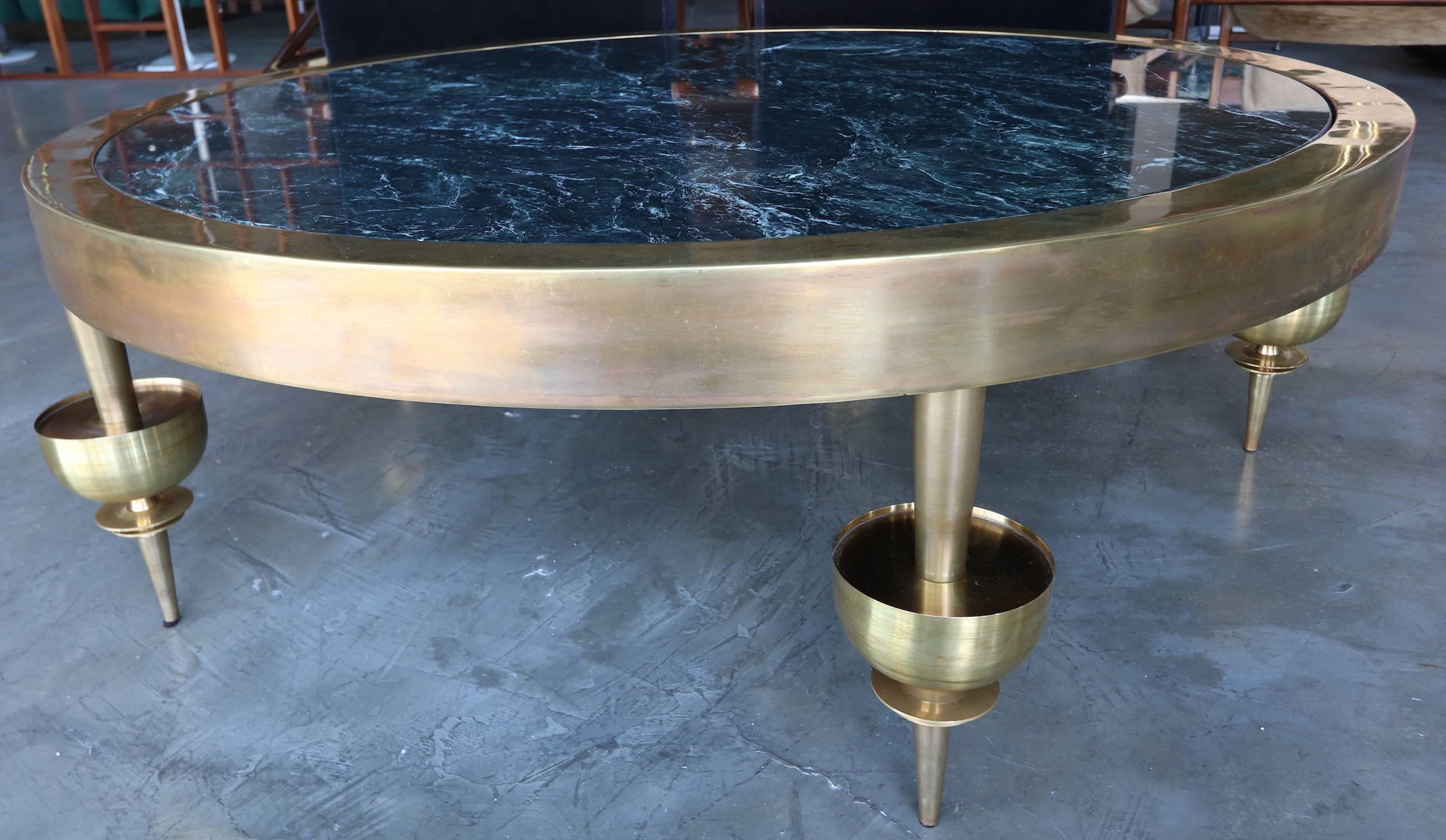 Custom brass coffee table in the style of Gio Ponti with decorative legs and green marble top. Handmade in Los Angeles by Adesso Imports. Can be done in different shapes, sizes, types of marble and finishes.