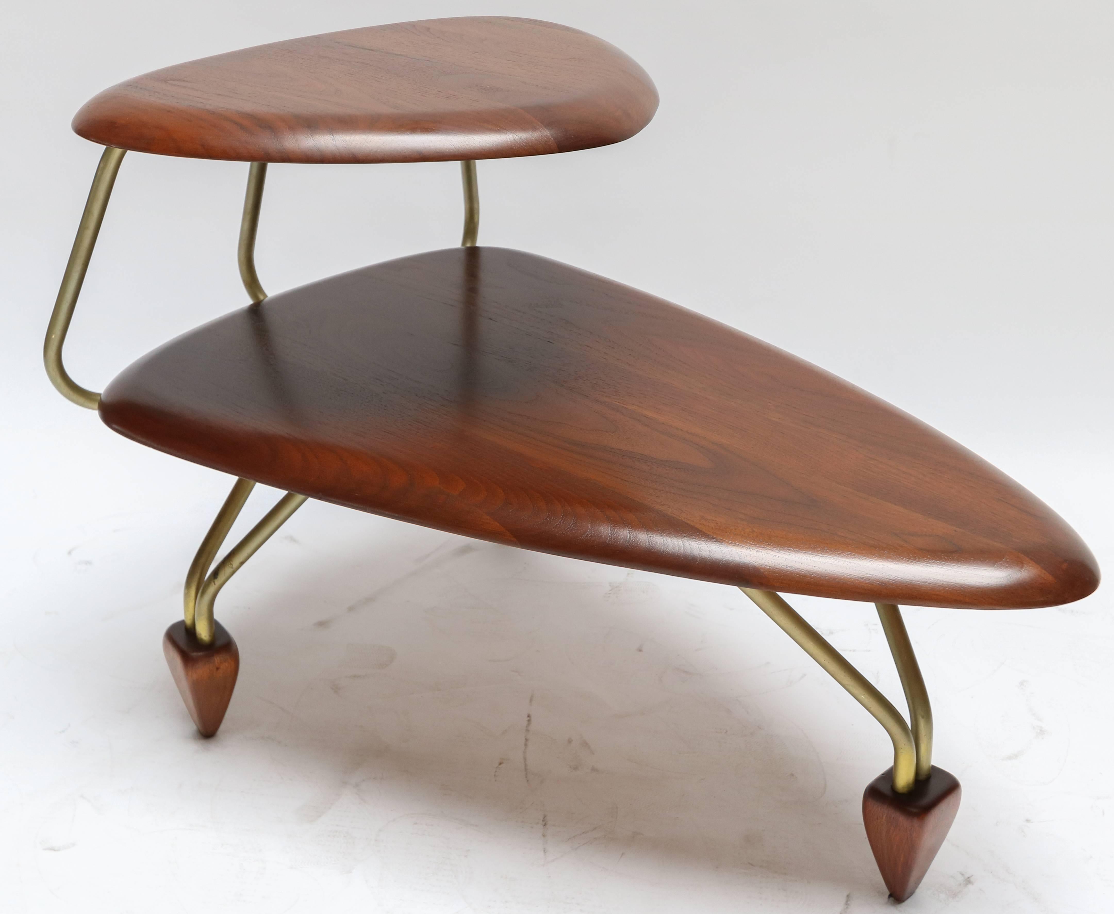 Pair of walnut side tables with surfboard styling by John Keal for Brown Saltman.

Lower shelf height is 12.75