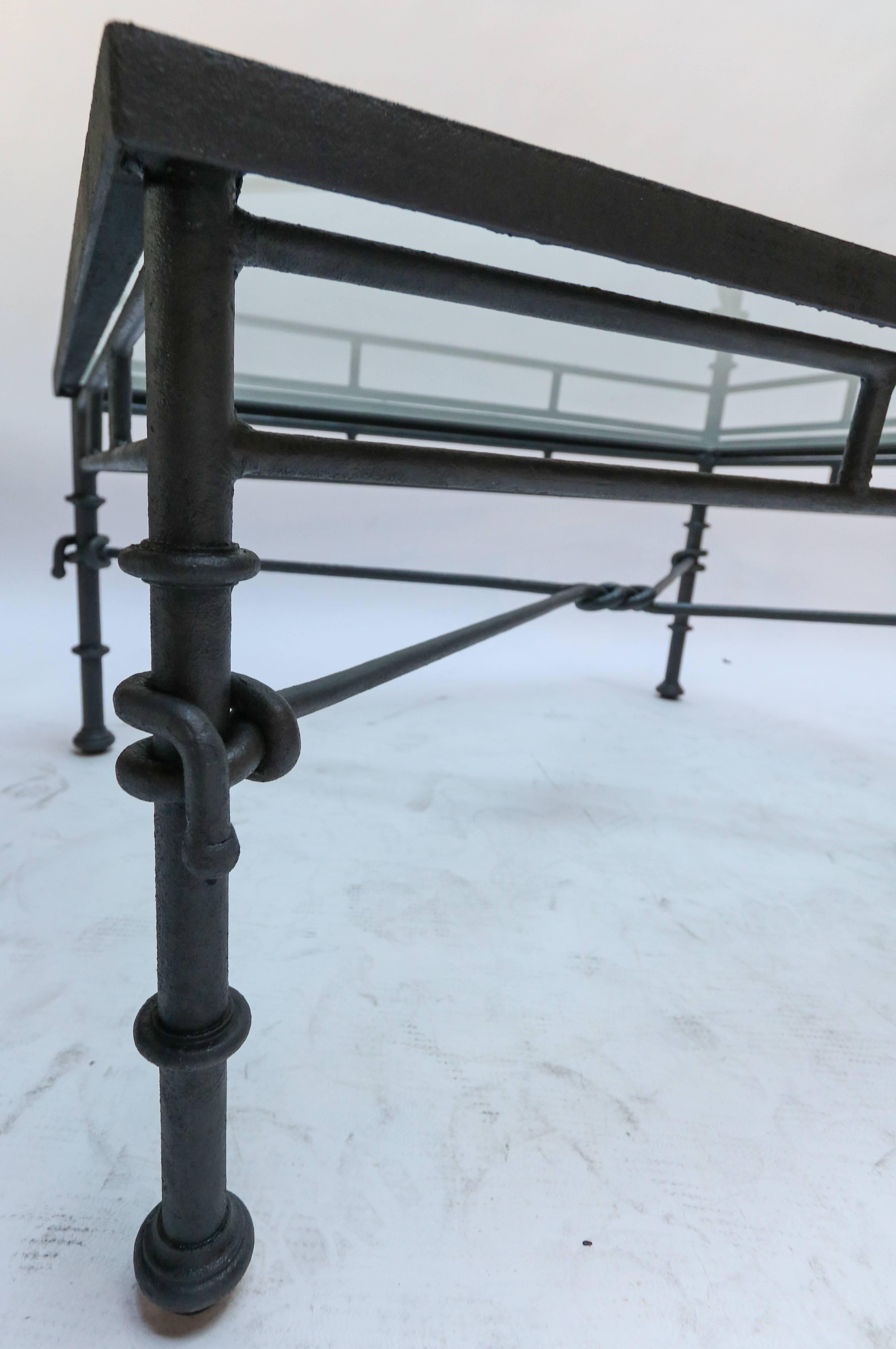 black wrought iron coffee table with glass top