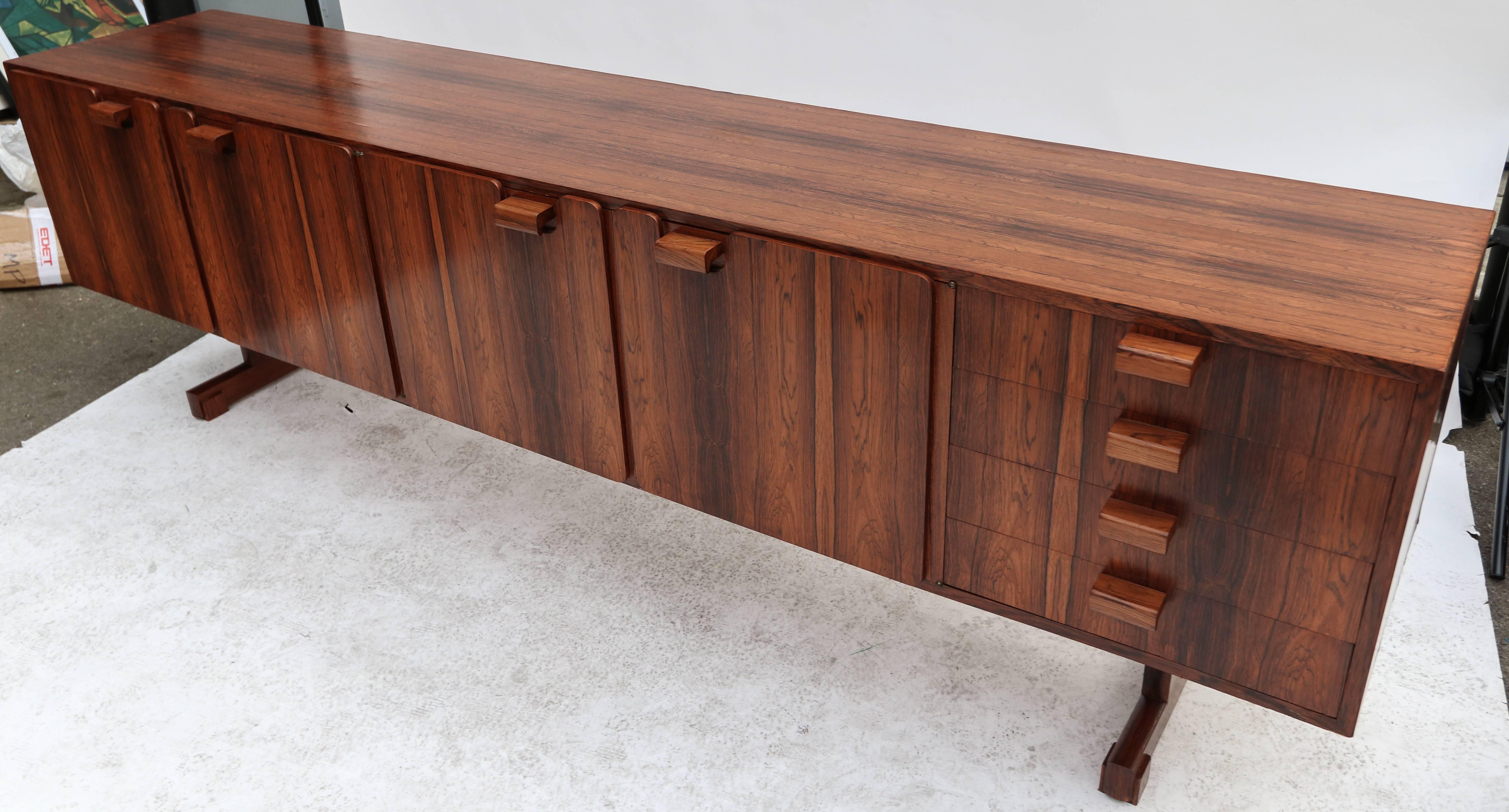 Brazilian jacaranda sideboard by Novo Rumo from the 1960s with two shelved cabinets and one set of drawers.