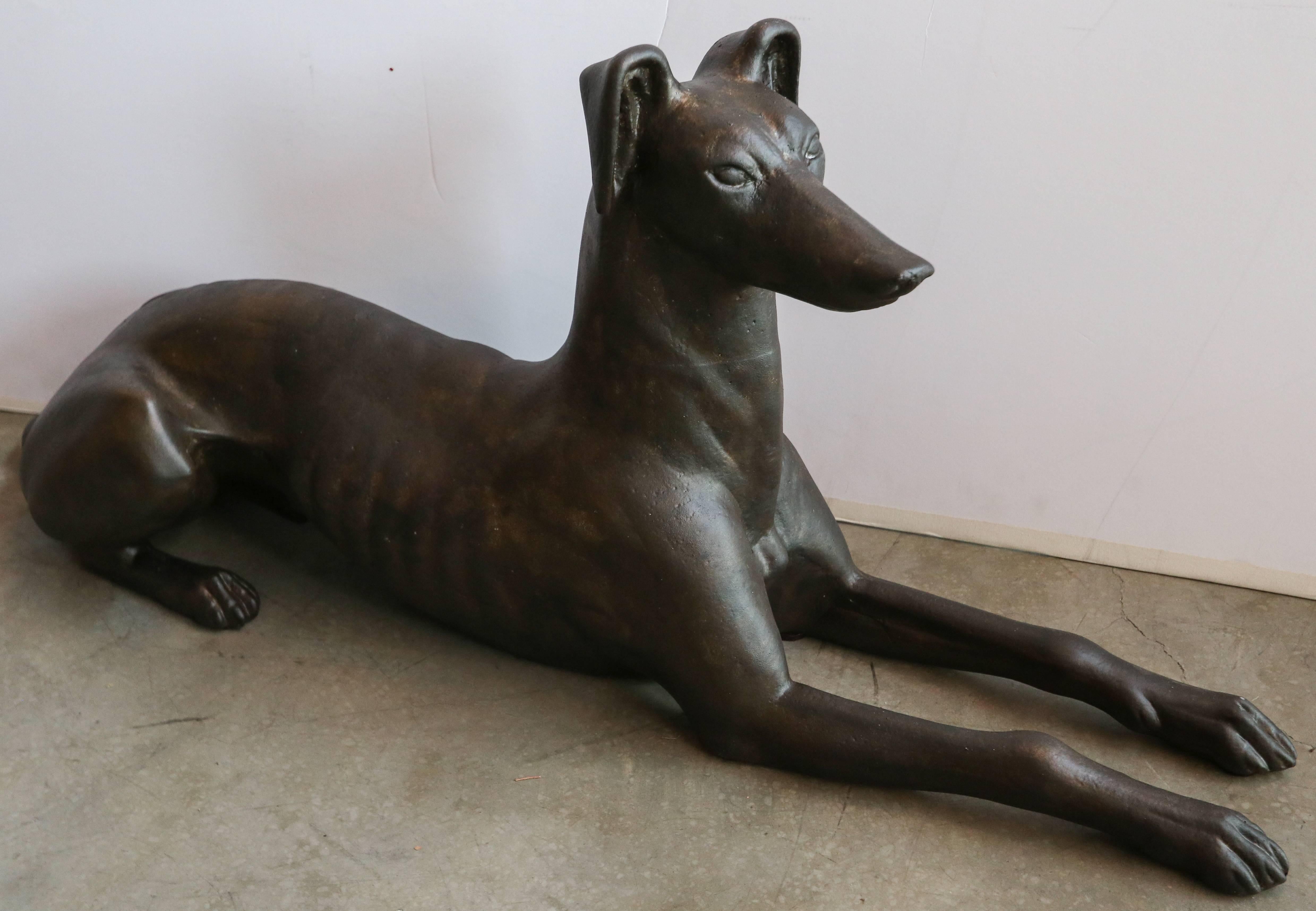 Pair of cast iron greyhound dog statues or sculptures.