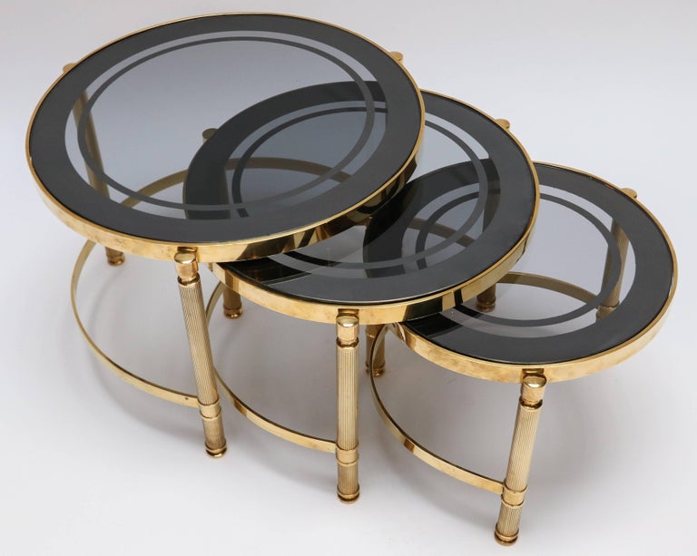 Set of Three Brass Nesting Tables with Smoked Glass Tops For Sale at