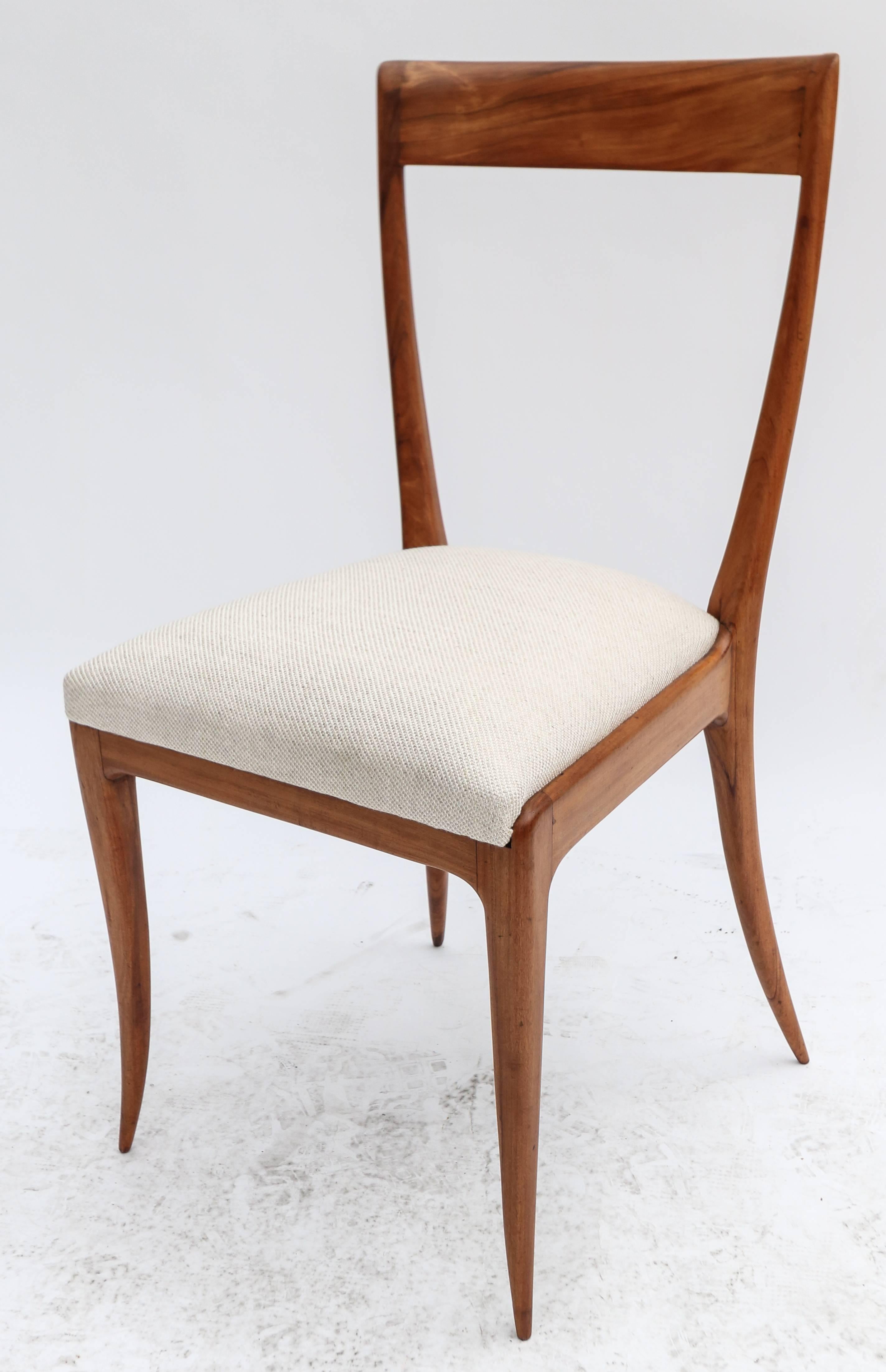 Set of eight Scapinelli 1960s dining chairs in Brazilian caviuna wood with beige linen upholstery.