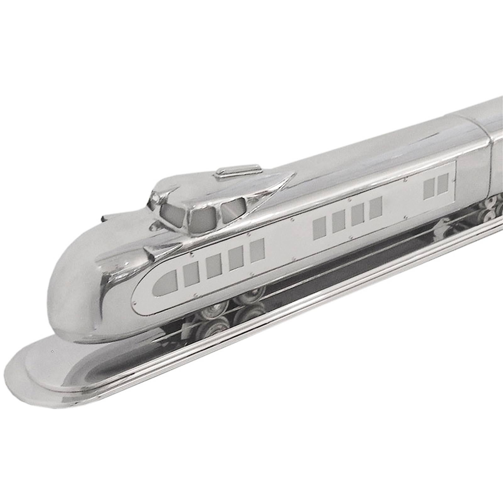 This large-scale train 5 1/2' long was made by General Train Company in 1933 for a short period of time. It has a machined aluminum presentation base and is wired to be displayed lite up or off. This train really defines the streamline vision of the