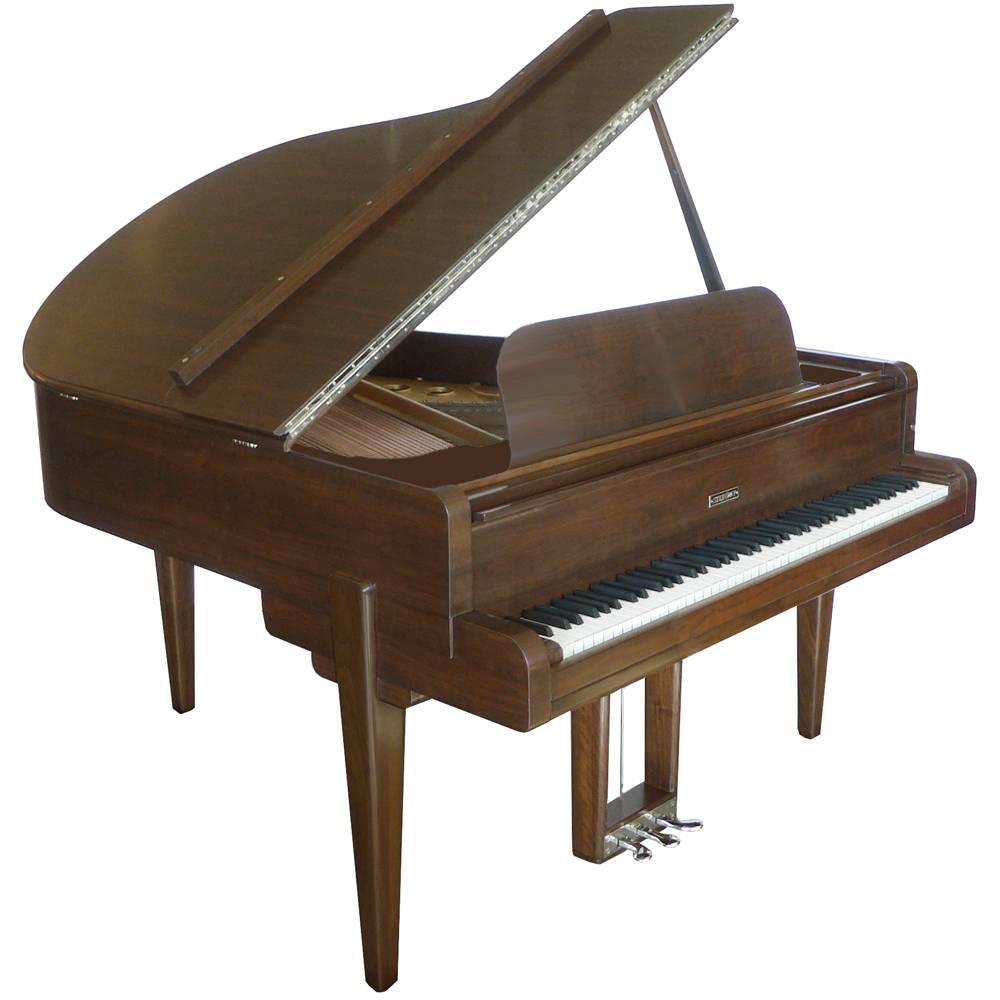 Fantastic walnut Streamline Moderne baby grand piano model M. Designed by Walter Darwin Teague for Steinway & Sons in 1938. This model was the more popular of two Art Deco models that Teaque designed for Steinway. Every detail is an ode to