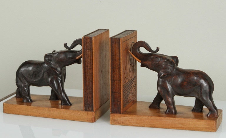 Art Deco Campaing style pair of carved wood elephant bookends.