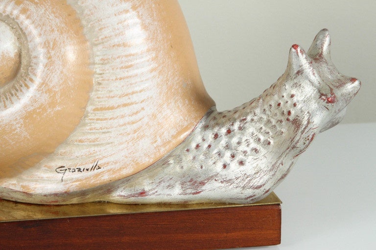 Mid-Century 1970s Italian hand-painted ceramic snail sculpture mounted on base of brass and wood, signed (unknown). Label underside handmade in Florence, Italy.