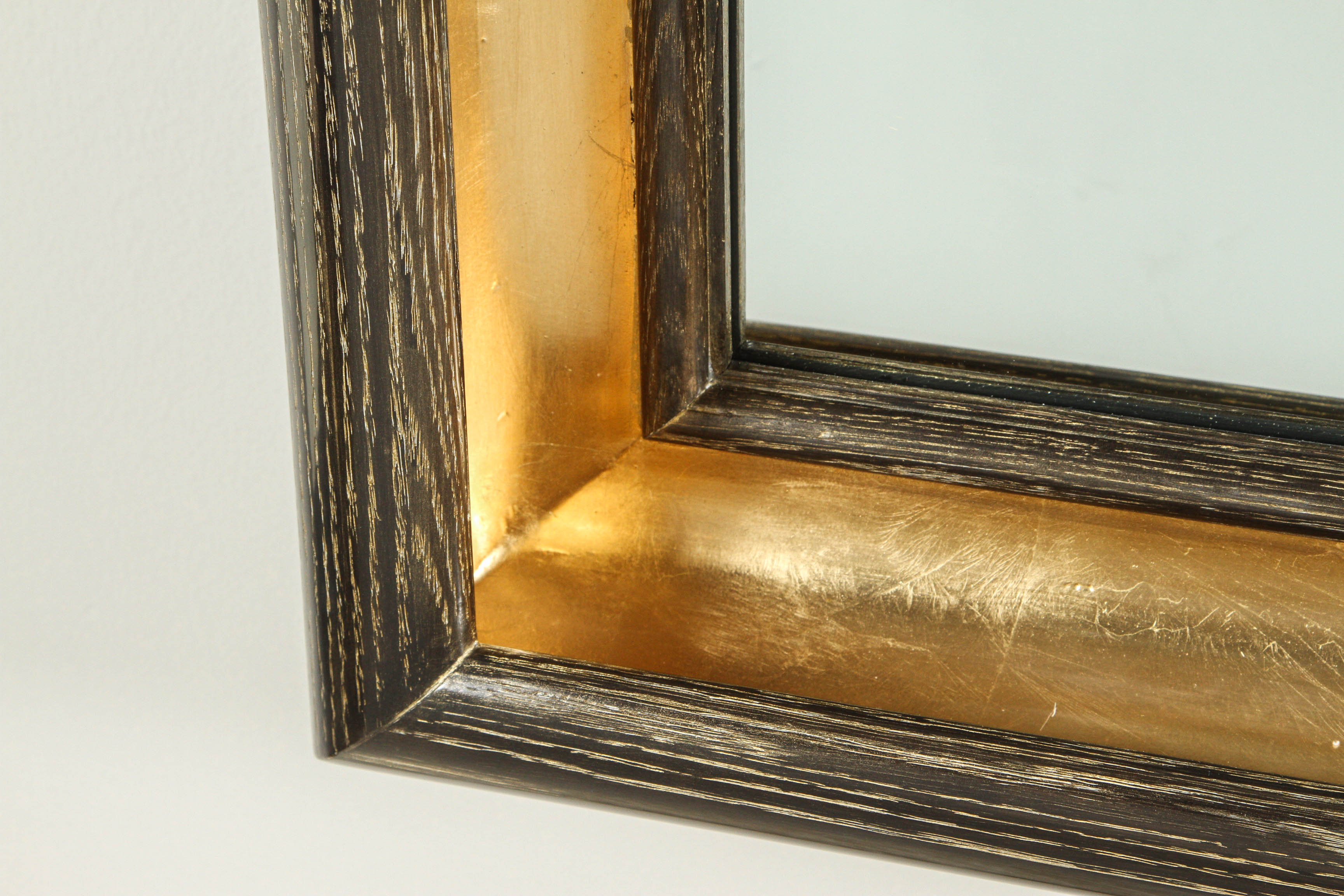 Modern Paul Marra Cove Mirror in Dutch gold metal cerused oak with a mocha finish and Dutch gold inner cove. 